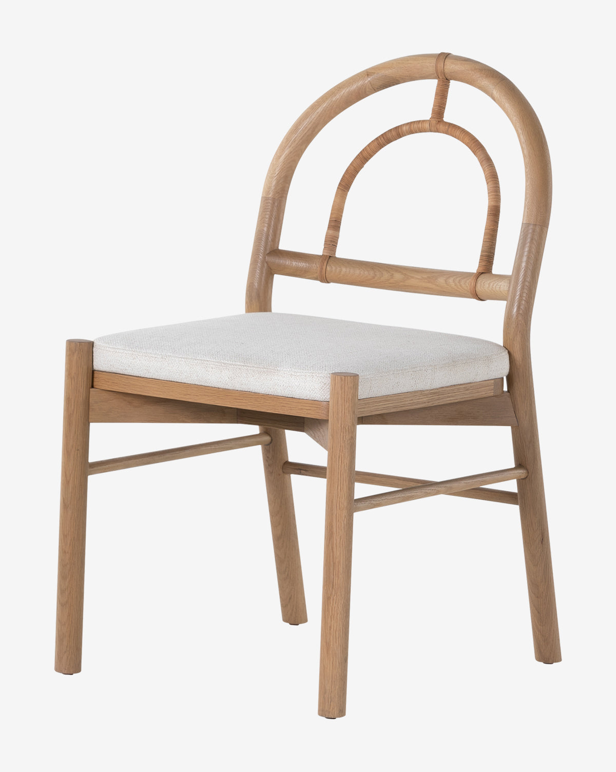 The Vasco Dining Chair features a curved backrest, woven detail, and upholstered light seat. Supported by four straight legs with crossbars, it offers both sturdy support and artistic style for your dining space, by McGee & Co.