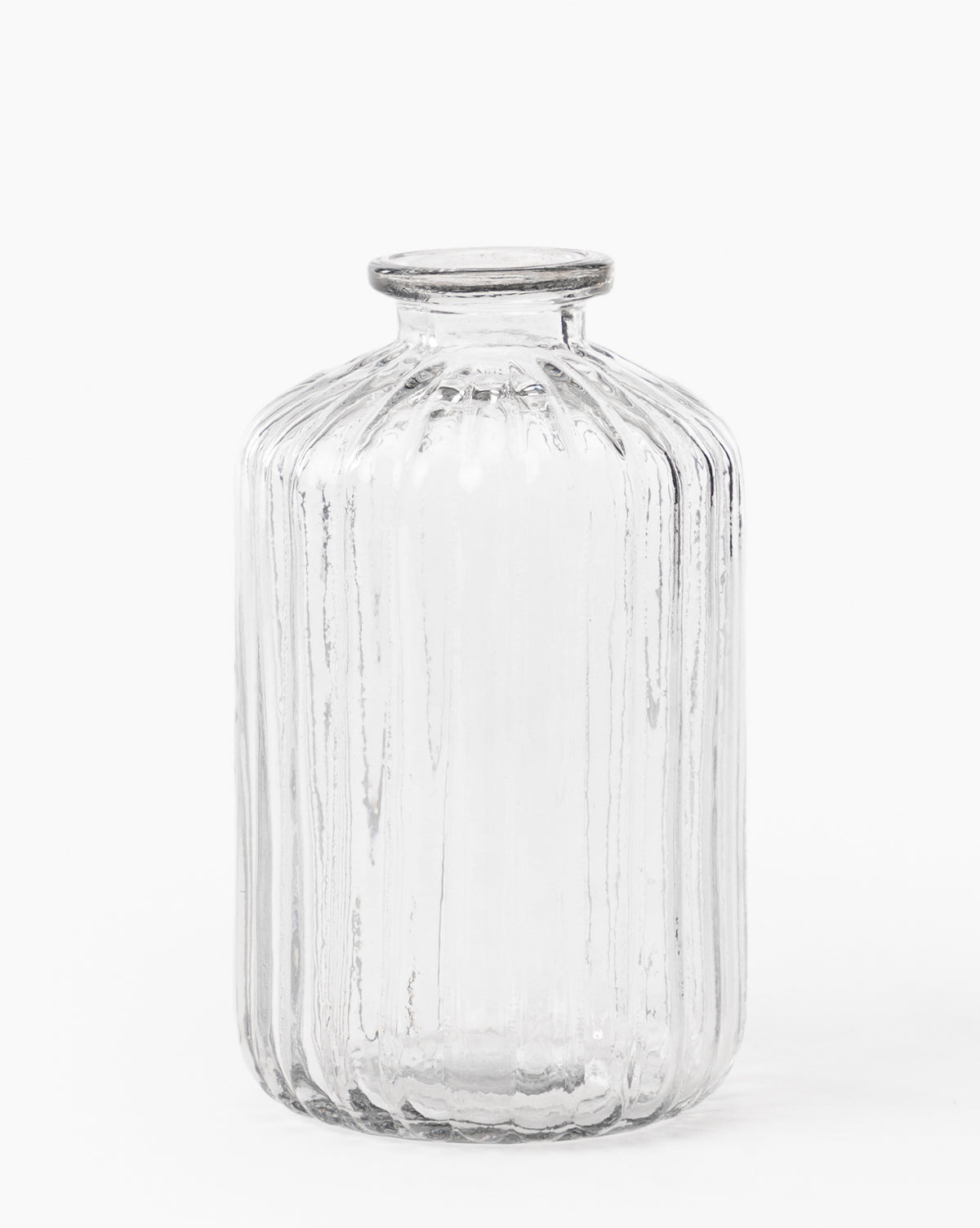 The Verlice Glass Cylinder Vase is mouth-blown with vertical textured ribbed lines, featuring a cylindrical shape and a short, narrow neck, set against a plain white background.