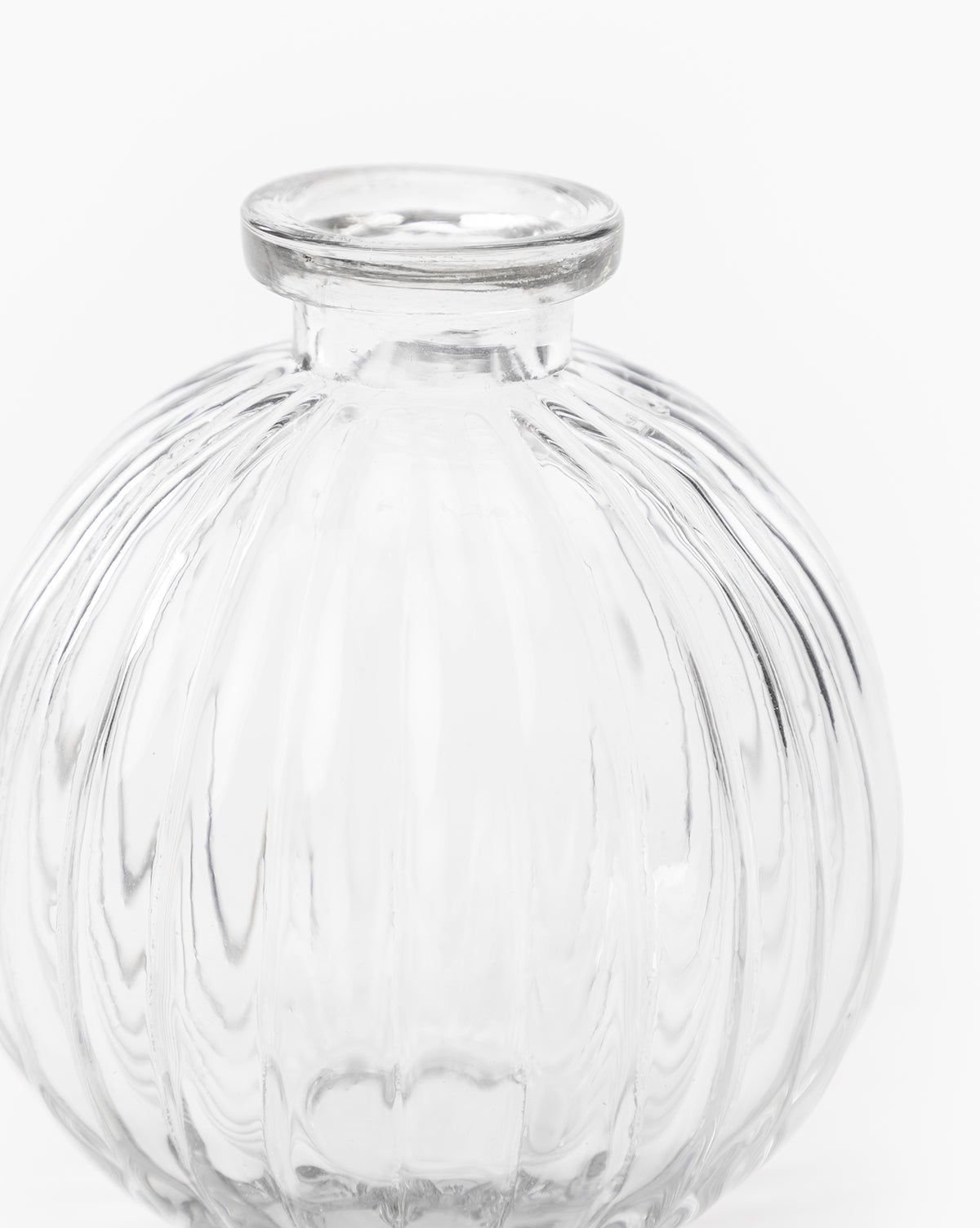 The Verlice Glass Round Vase is a clear, mouth-blown, round vase with vertical ridges and a small circular opening—ideal for decorative vignettes—displayed against a plain white background.