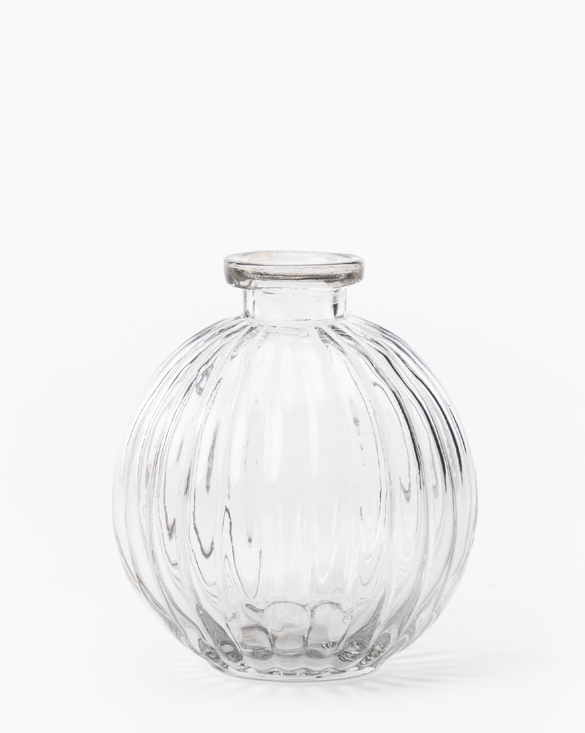 The Verlice Glass Round Vase features mouth-blown glass with a vertical ribbed texture and a small, short neck—ideal for decorative vignettes. Shown against a plain white background.
