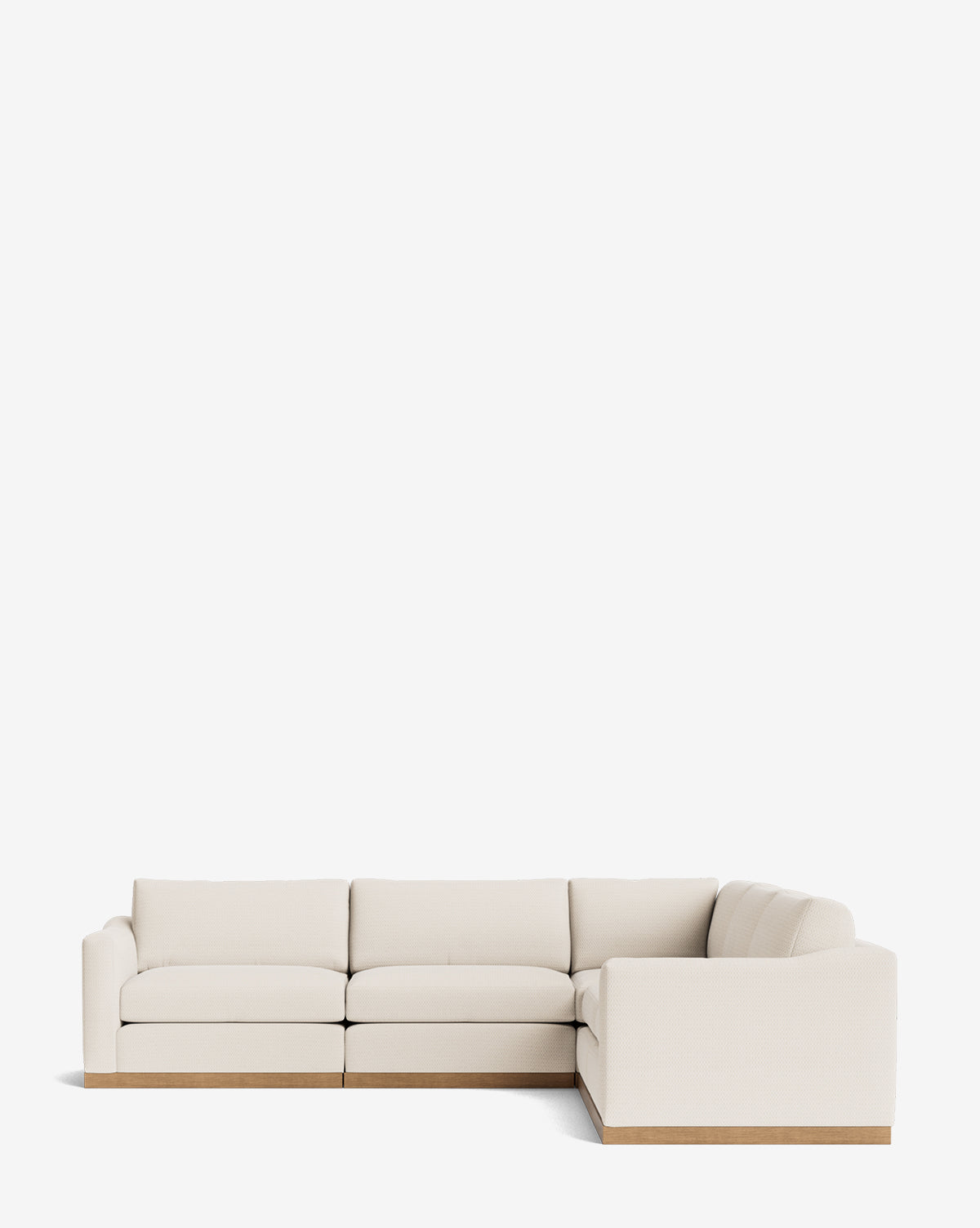 The Vernon Modular L Sectional 117.5 features cream-colored upholstery and a wooden base, showcased against a plain white background, by McGee & Co.