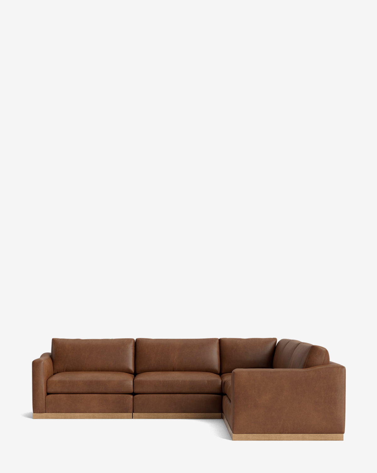 The Vernon Modular L Sectional 117.5 is a spacious brown leather sofa with plush cushions and a low backrest, displayed against a plain white background, by McGee & Co.