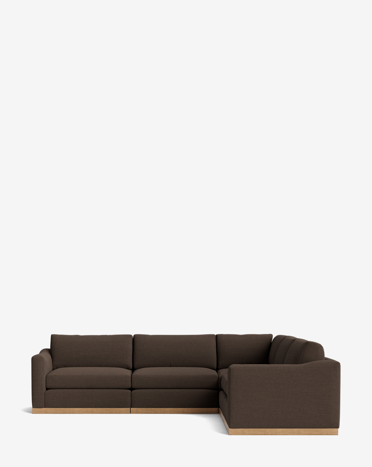 The Vernon Modular L Sectional 117.5 is a dark brown, L-shaped sofa with plush cushions and a wooden base, displayed against a plain white background by McGee & Co.