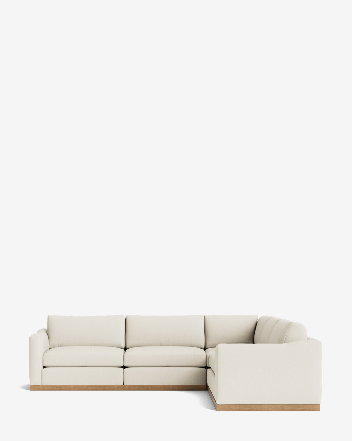 The Vernon Modular L Sectional 117.5 features light beige upholstery and a low wooden base, offering a modern, customizable design that brings style and versatility to any contemporary living space, by McGee & Co.