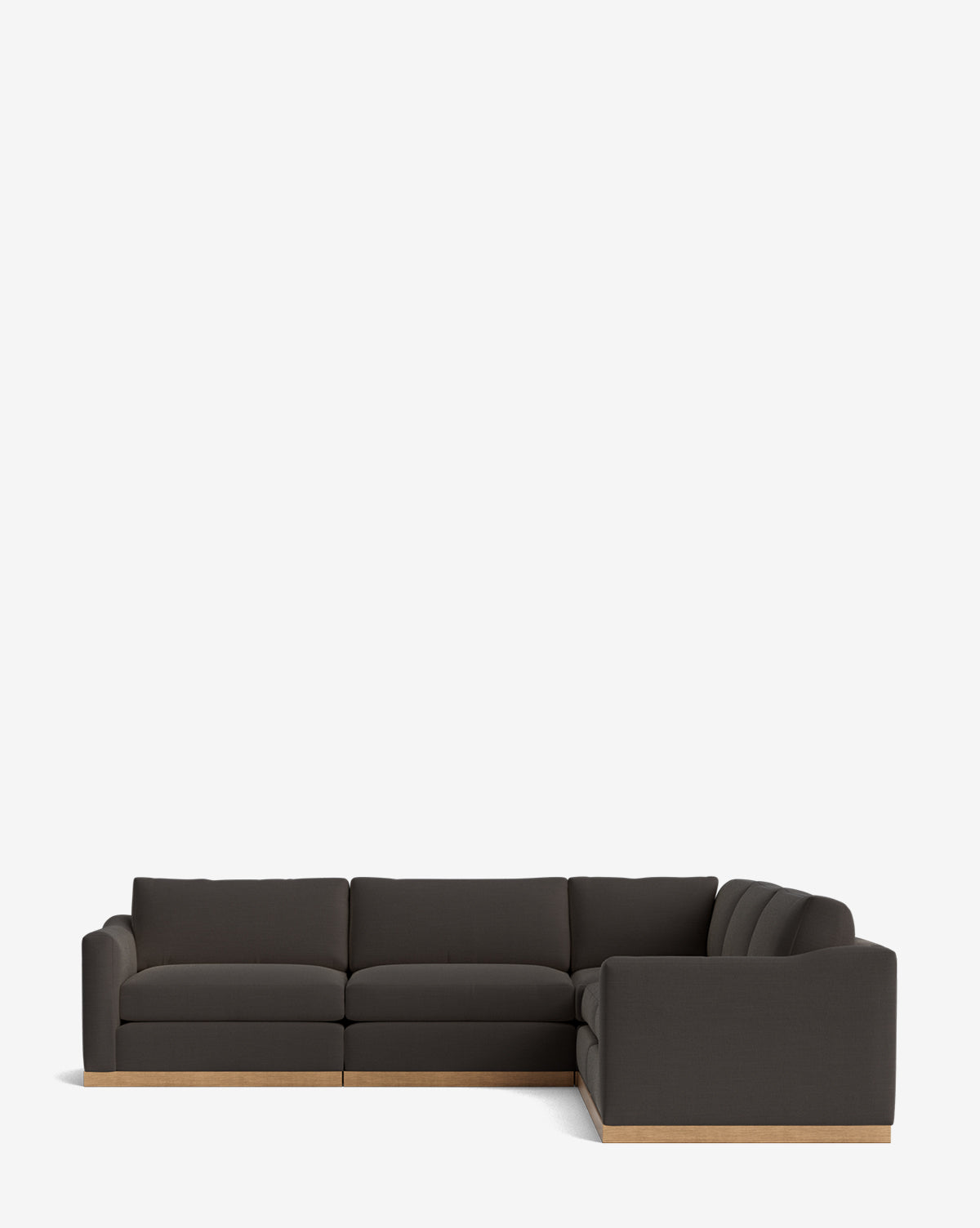 The Vernon Modular L Sectional 117.5 features dark charcoal velvet upholstery and a light wooden base, displayed against a plain white background, by McGee & Co.