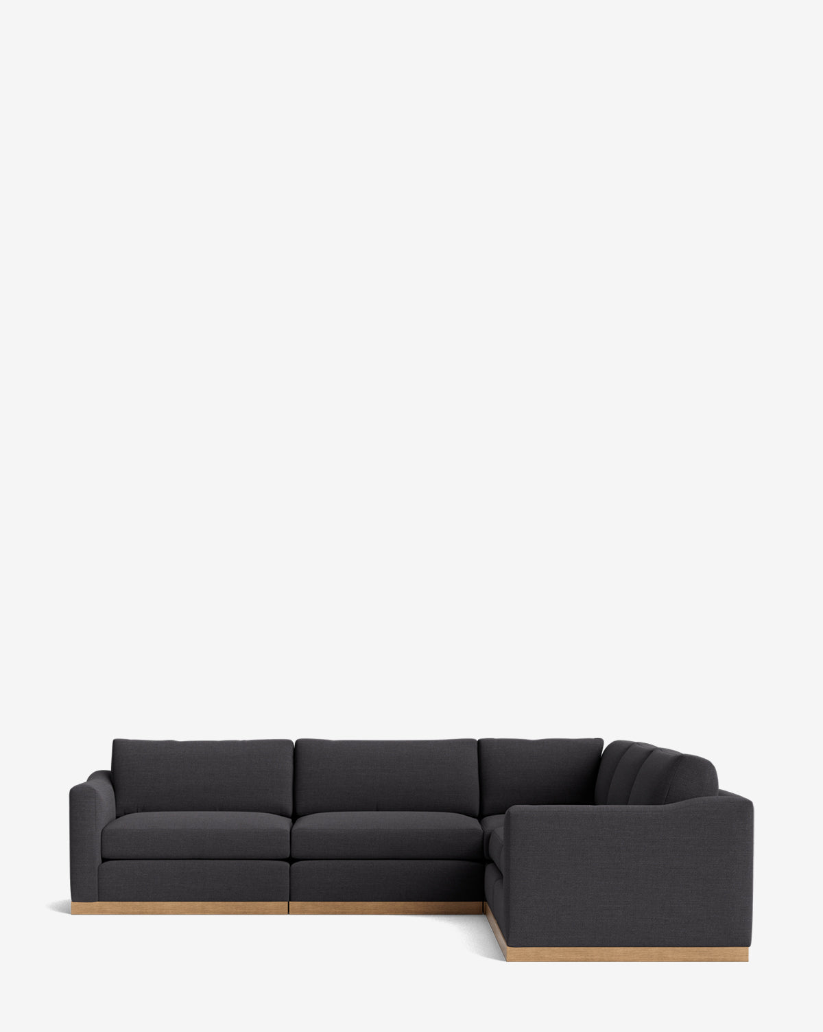 The Vernon Modular L Sectional 117.5 features a modern design in dark gray with plush cushions and a light wood base, displayed against a plain white background, by McGee & Co.