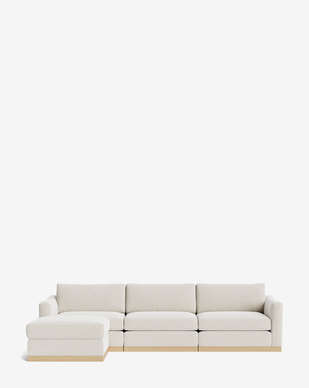 The Vernon Modular Sofa with Ottoman 121 features light beige upholstery, a left-side chaise, and a light wooden base, by McGee & Co. This customizable fabric sofa adds style and flexibility to any living space, shown here against a plain white background.