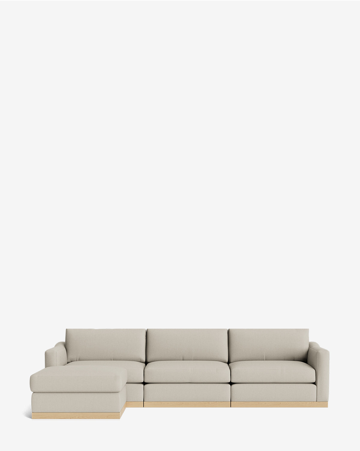 The Vernon Modular Sofa with Ottoman 121 is a modern, customizable fabric sectional in light beige, featuring a left-side chaise lounge and elegant wooden base accents, shown against a plain white background by McGee & Co.