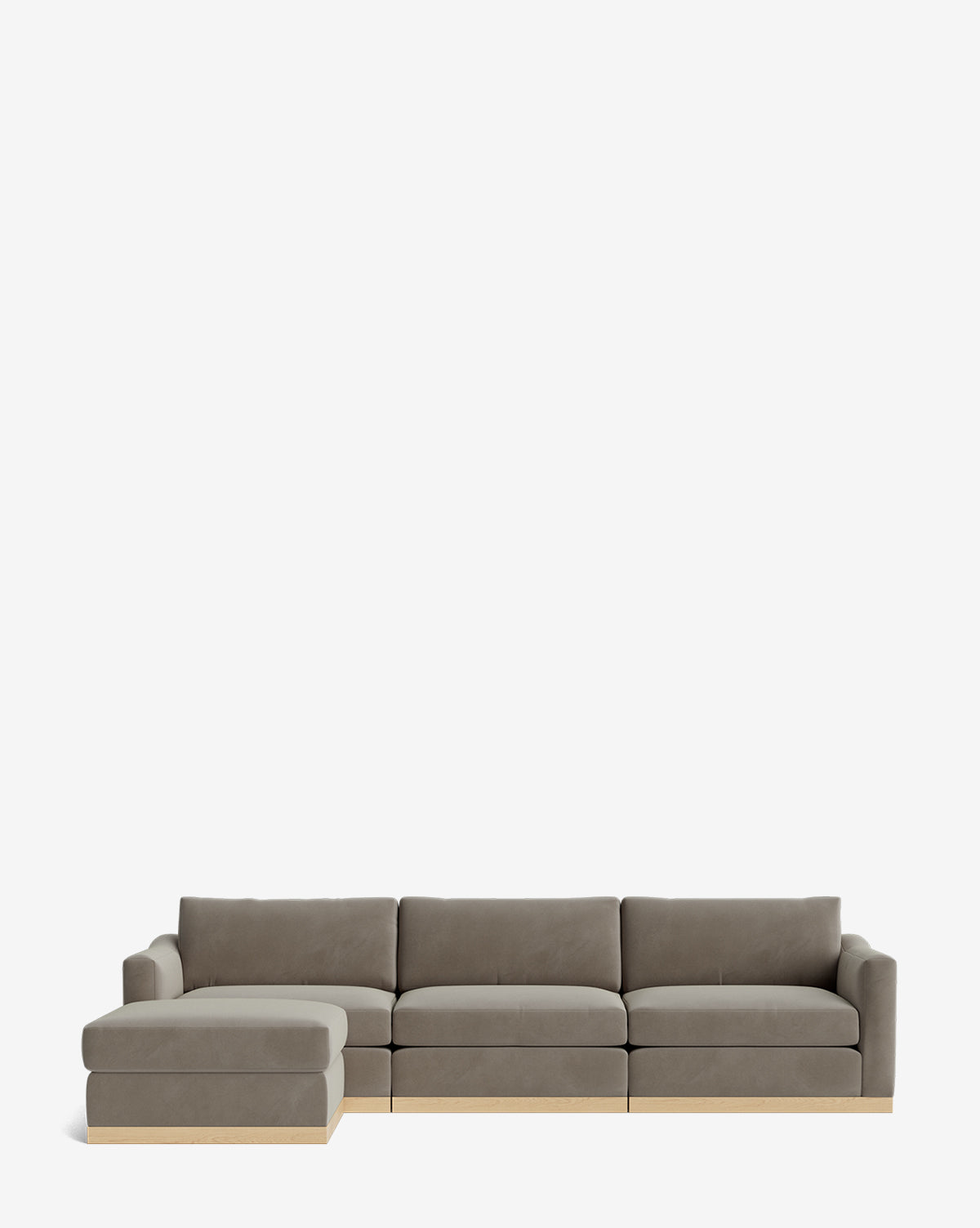 The Vernon Modular Sofa with Ottoman 121 is a modern gray fabric sofa featuring a left-facing chaise, light wooden base, and includes an ottoman, shown against a plain white background by McGee & Co.