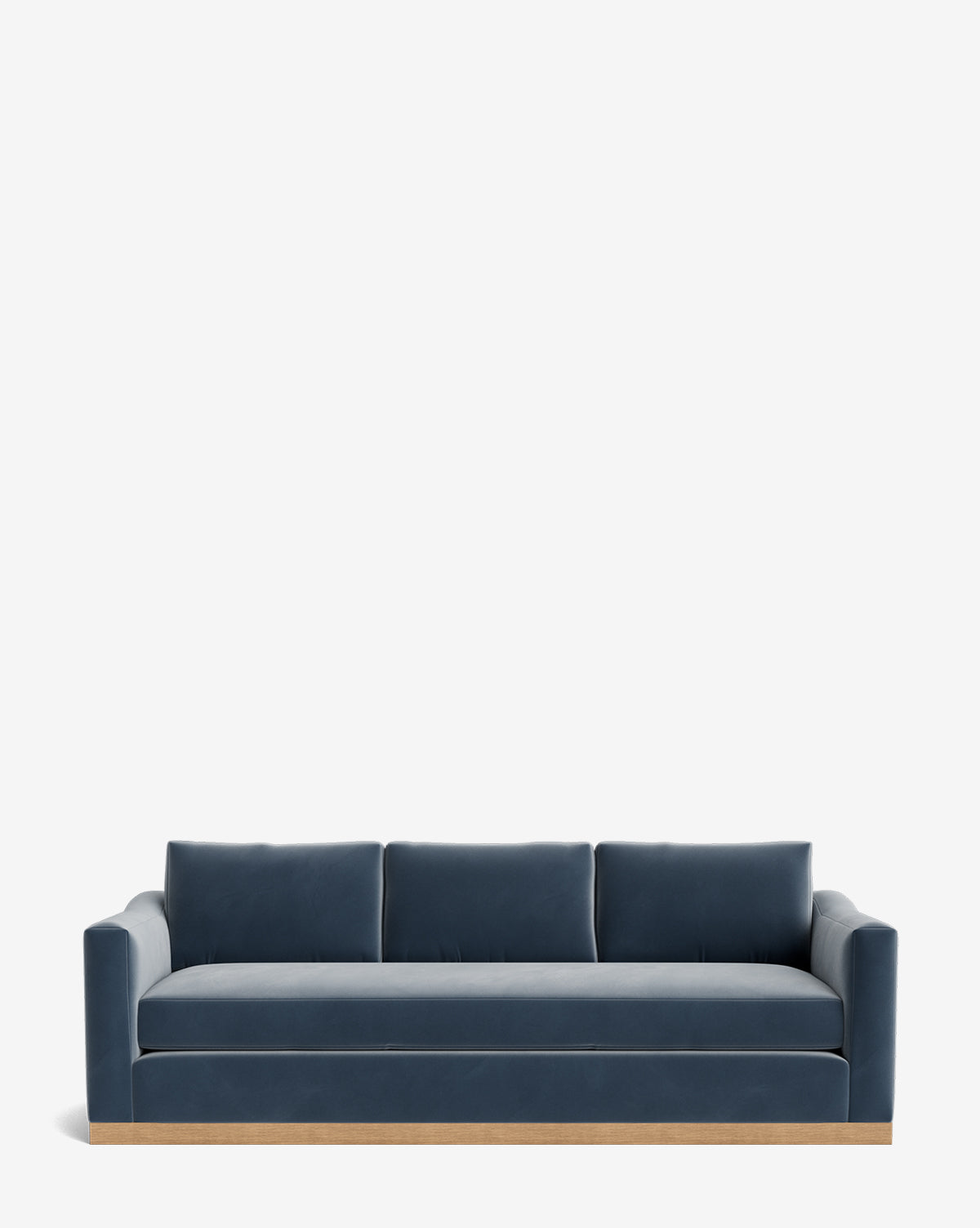 The Vernon Sofa 92 features navy blue velvet upholstery, three seat cushions, and straight armrests on a light alder wood frame, shown against a plain white background by McGee & Co.