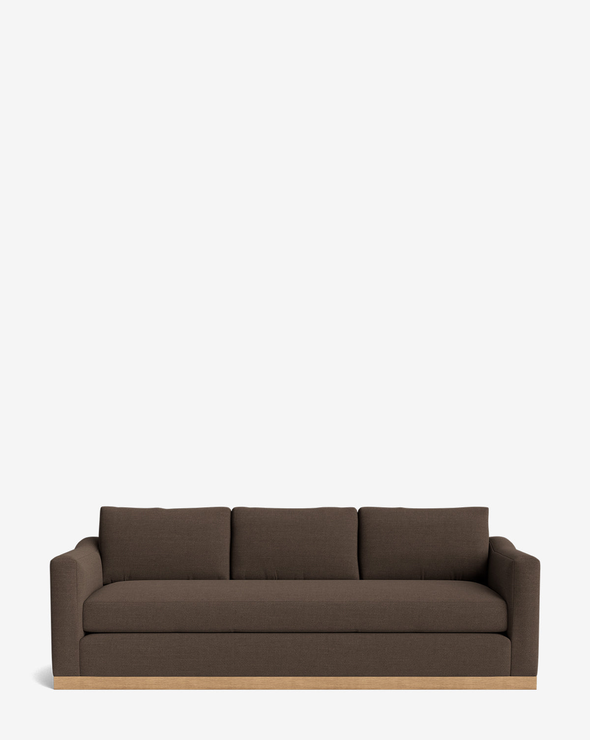 The Vernon Sofa 92 is a modern dark brown velvet three-seater with straight arms, three seat cushions, and a light alder wood frame base, shown against a plain white background by McGee & Co.