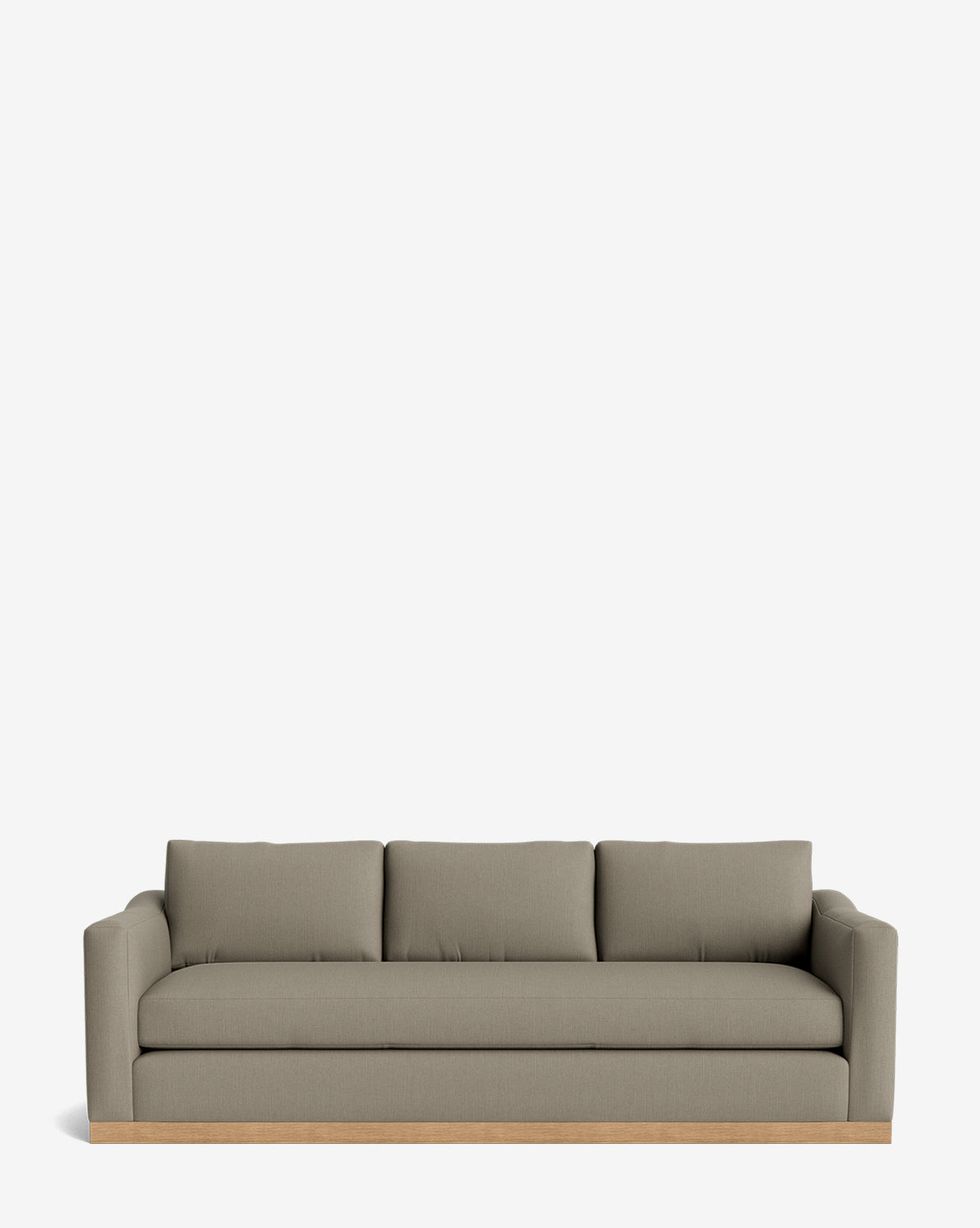 The Vernon Sofa 92 is a modern three-seater with light olive velvet upholstery, straight arms, and three back cushions on a sleek alder wood frame, shown against a plain white background by McGee & Co.