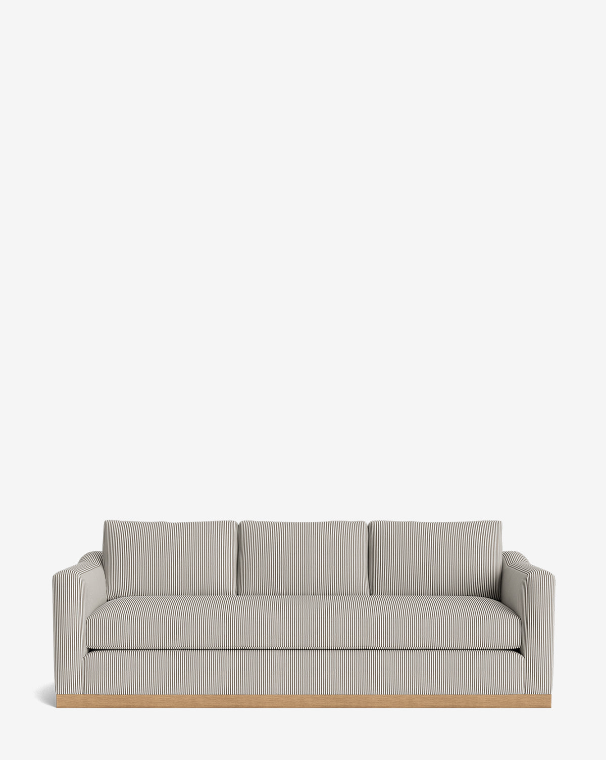 The Vernon Sofa 92 is a modern three-seater with light gray and white striped velvet, square arms, three seat and back cushions, and an alder wood frame base, shown against a plain white background by McGee & Co.