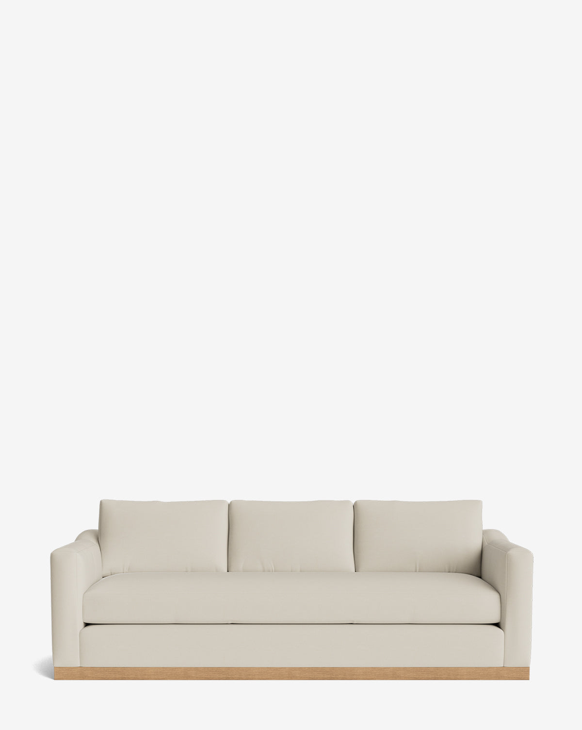 The Vernon Sofa 92 is a modern, cream-colored sofa with three seat and back cushions, rounded armrests, and a light alder wood frame, shown against a plain white background by McGee & Co.