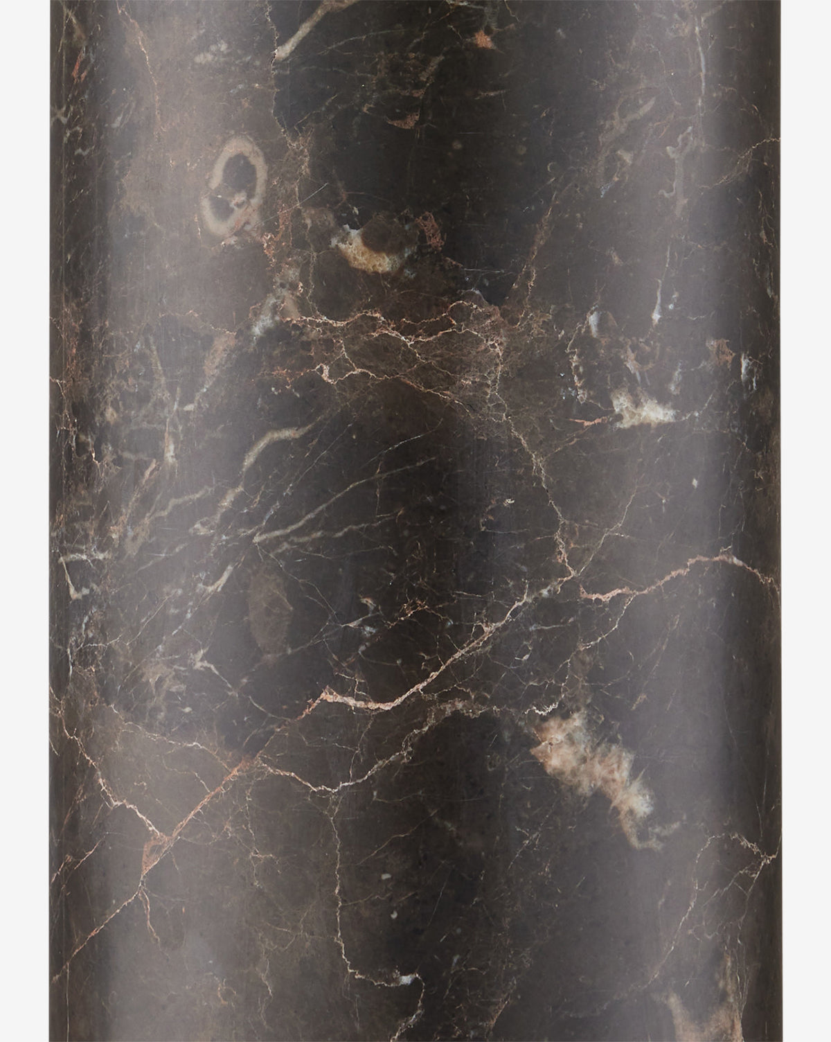 Detailed close-up of a dark brown marble surface with light brown and white veins, highlighting the rich, polished stone texture—ideal for the Vespera Table Lamps elegant marble column base and antique brass accents, by McGee & Co.