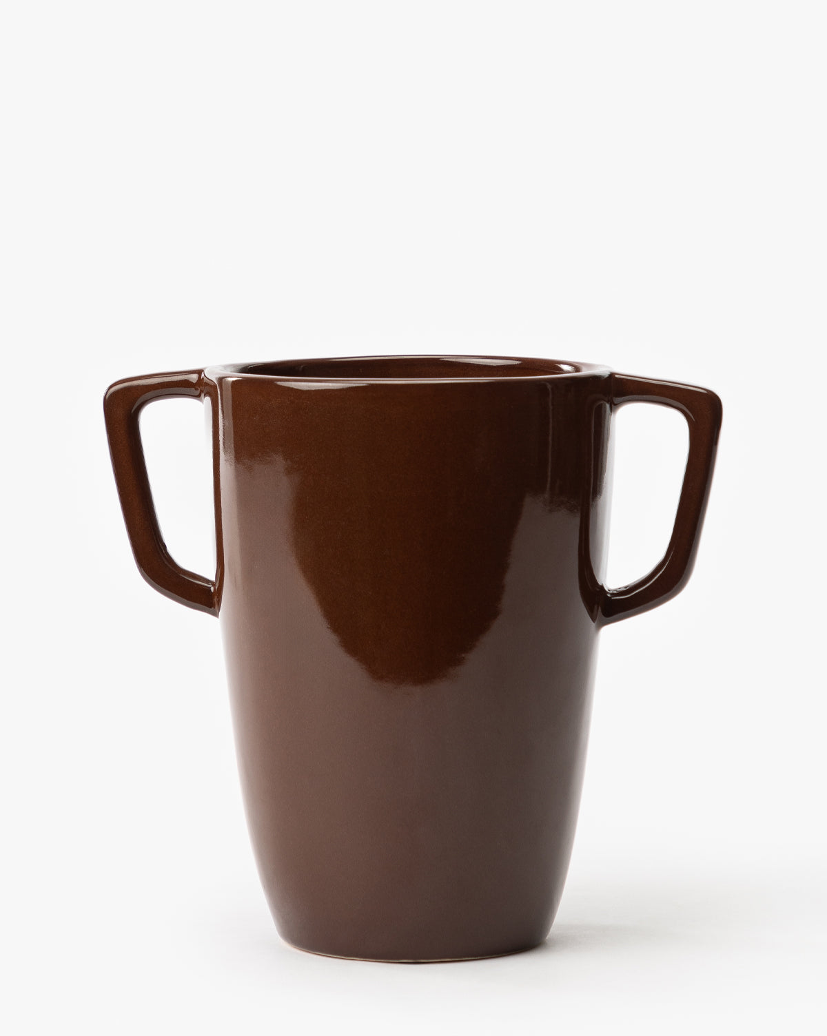 The Victoire Vase is a glossy, dark brown earthenware piece with two angular handles on opposite sides, displayed against a plain white background, by McGee & Co.