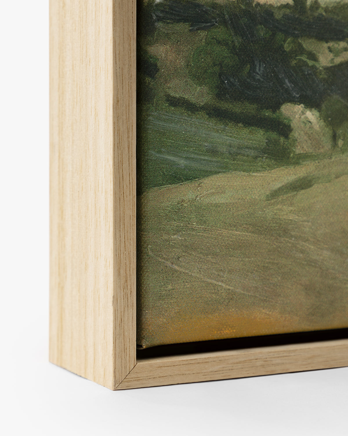 Close-up of the bottom corner of View of the Town, a landscape giclee print on canvas, framed with a light oak float frame and highlighting the artworks edge and textured surface by McGee & Co.