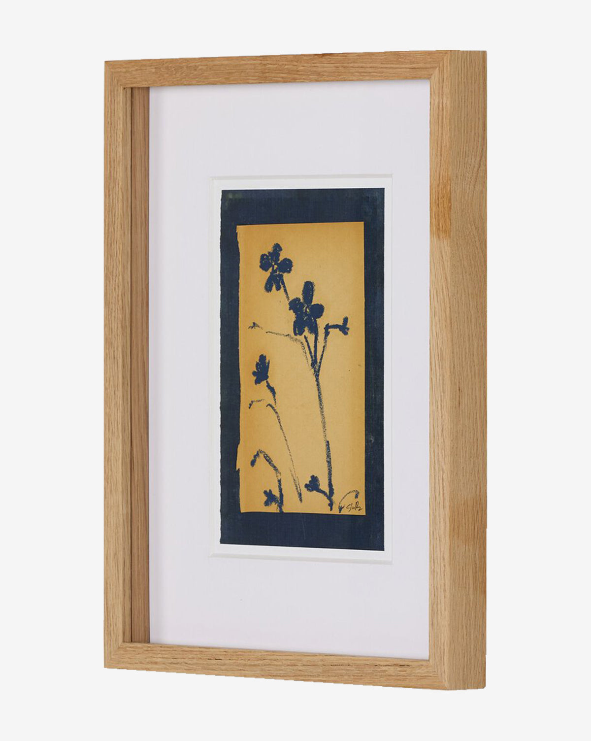 Vintage Blue Daisy by Shaina Page features a botanical print of dark blue wildflower silhouettes on yellow fine art paper, presented with a wooden oak frame, dark blue border, and white matting, by McGee & Co.