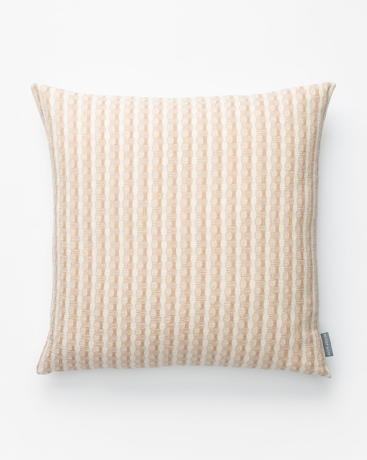 The Vintage Natural Patterned Pillow Cover No. 6 is a square pillow cover with a beige and white geometric textured design, shown on a white background. A small grey tag is attached to one edge, by McGee & Co.