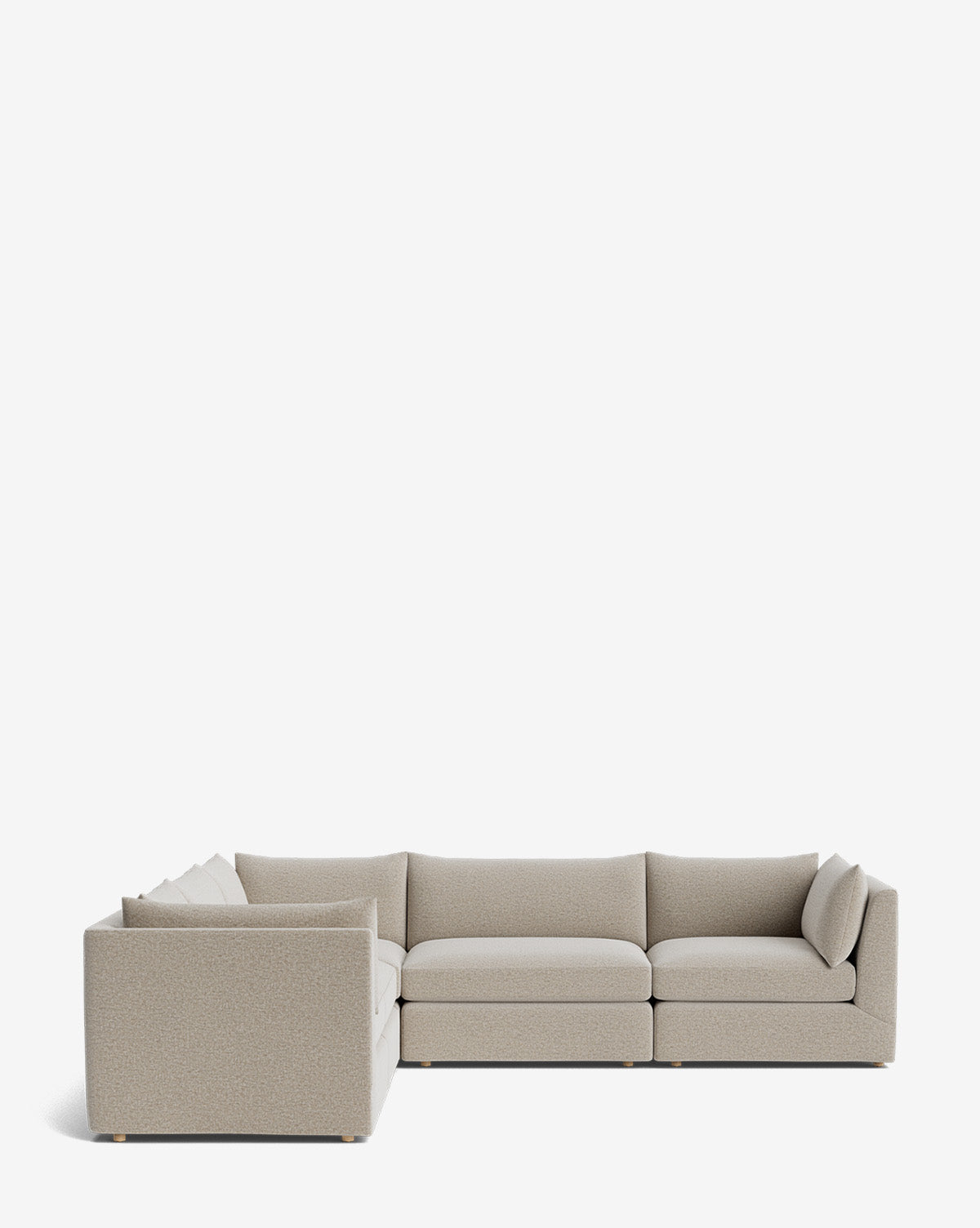 The Makerspalm Vivienne Modular L Sectional features a modern, light beige design with plush cushions and a low-profile silhouette, showcased against a plain white background, McGee & Co.