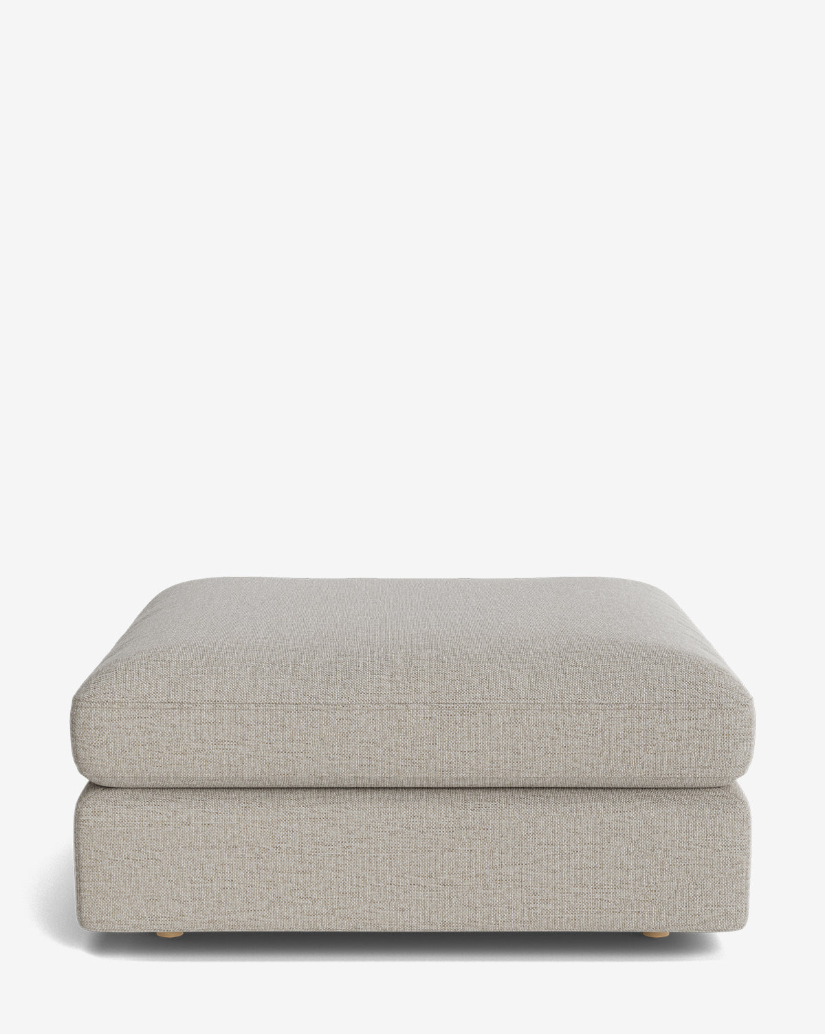 The Vivienne Modular Ottoman features a rectangular, light beige upholstered design with small dark feet and a modern, minimalist look. Perfectly blending function and style, it’s ideal for any contemporary space by McGee & Co.