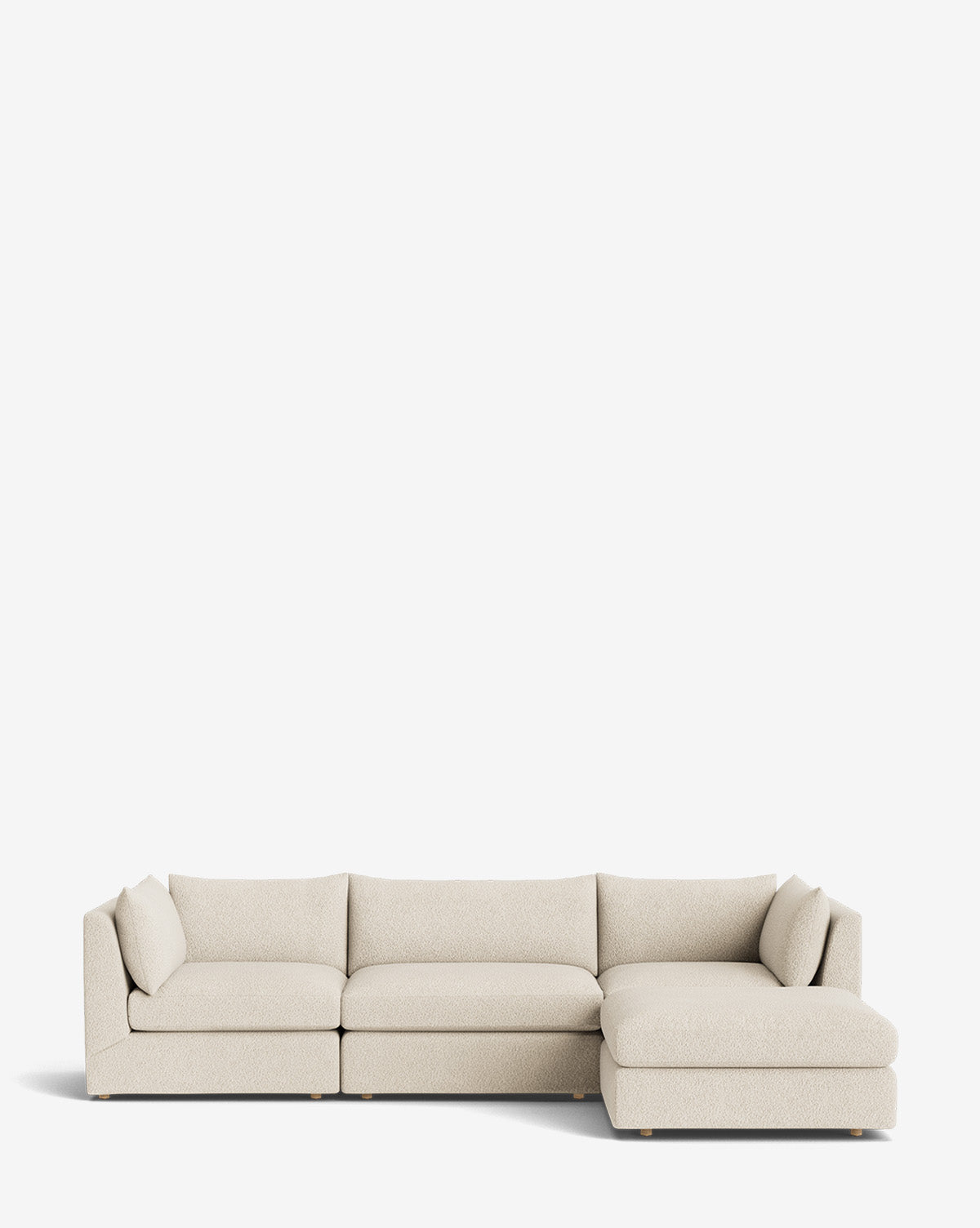 The Vivienne Modular Sofa with Ottoman is a handmade, beige L-shaped sofa featuring three left-side seat cushions and an extended right-side chaise, displayed against a plain white background by McGee & Co.