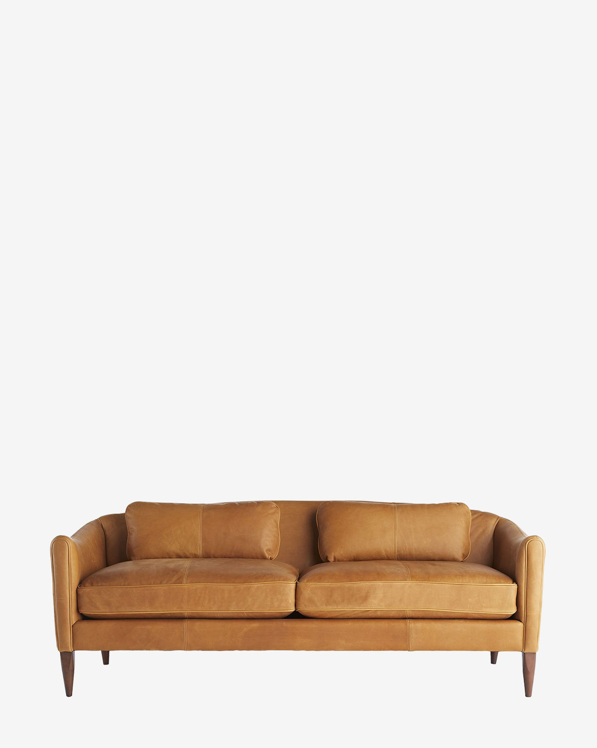 The Warner Leather Sofa 80.5 is a tan, vintage-inspired settee featuring two large seat and back cushions with maple wood legs, displayed against a plain white background by McGee & Co.