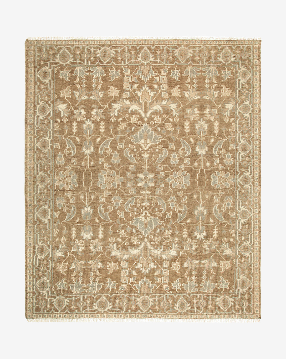 The Wayland Hand-Knotted Wool Rug is rectangular with intricate floral and geometric patterns in beige and ivory, a detailed border, and short fringe on the shorter edges, by McGee & Co.