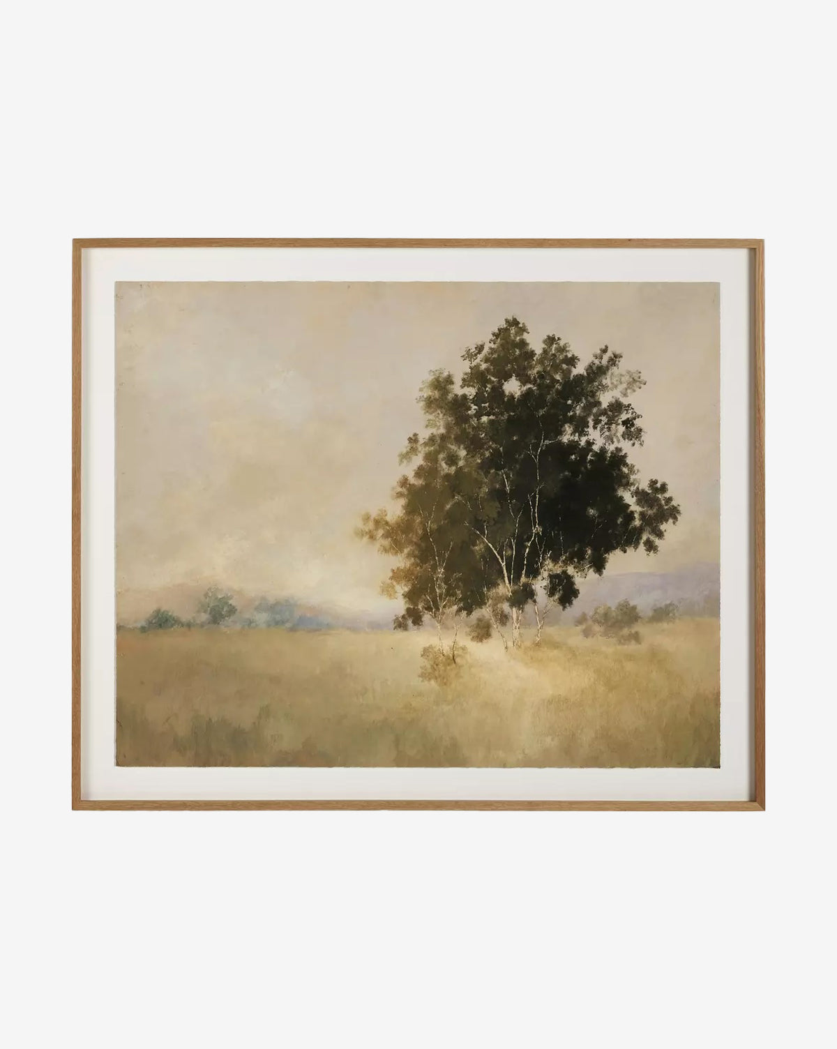 We Woke To A Dream by Aileen Fitzgerald is a framed wall art piece depicting a serene landscape with a leafy tree in grassy fields, distant trees, and a hazy sky, all in earthy tones set within an elegant white oak frame, by McGee & Co.