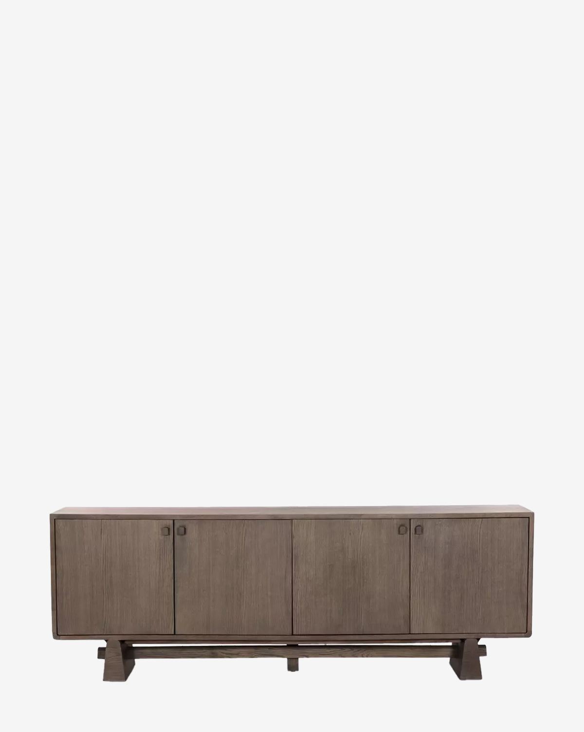 The Werner Aged Oak Sideboard features four cabinet doors, a rectangular silhouette, and a minimalist design. It stands on sturdy legs and is showcased against a plain white background by McGee & Co.