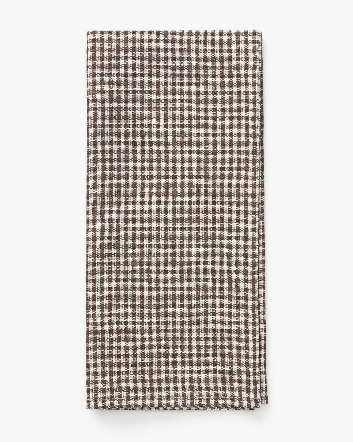 The Westport Linen Tea Towel, featuring a brown and white gingham checkered pattern, is shown folded on a white background, by McGee & Co.