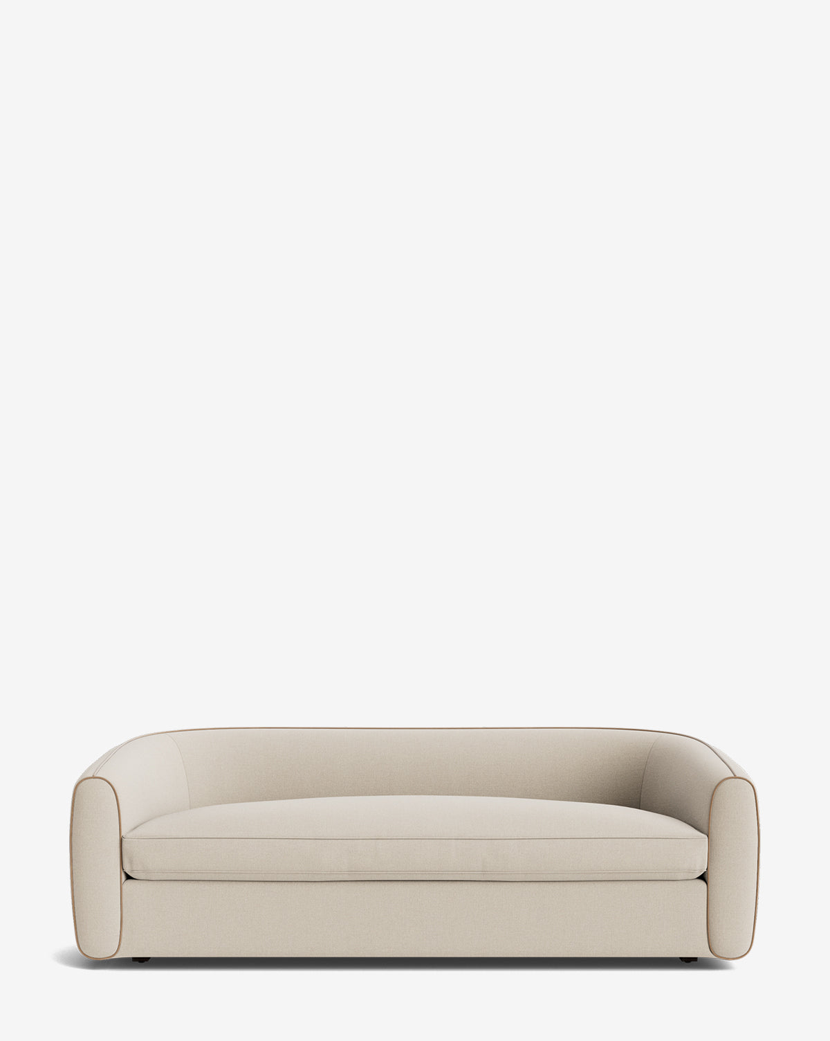 The Wexler Sofa 90 is a modern, low-profile beige sofa with rounded arms and backrest, upholstered in customizable designer fabric, shown against a plain white background by McGee & Co.