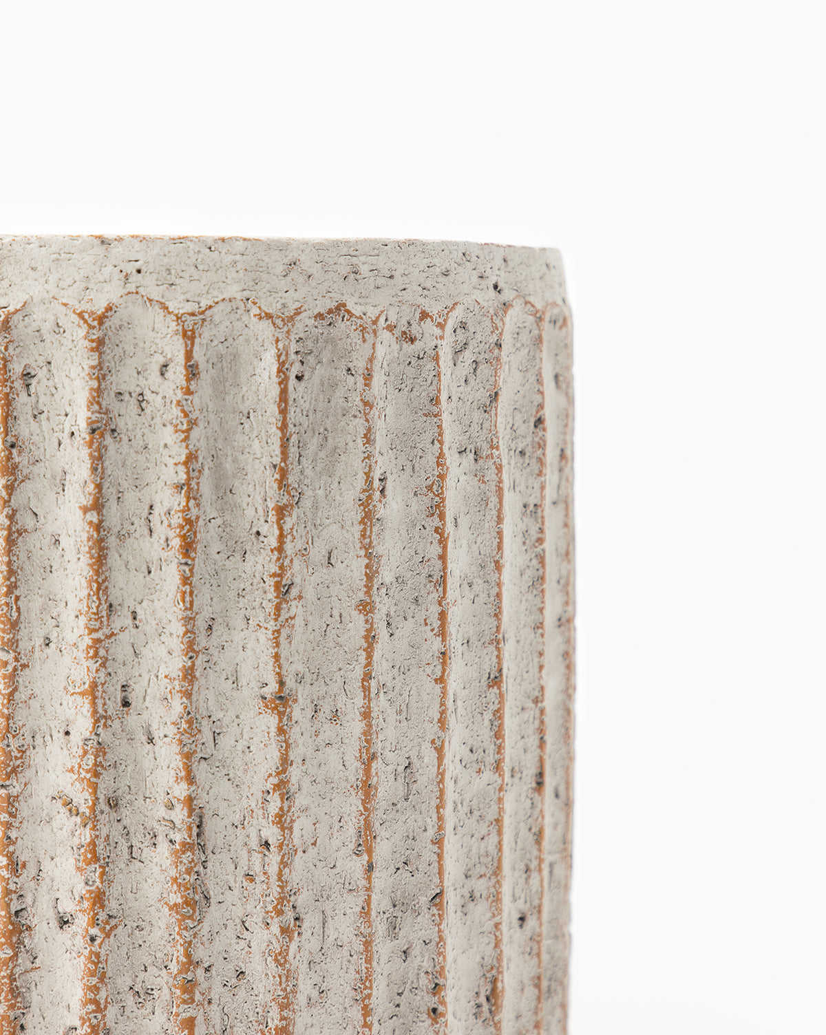 Close-up of the Whitewashed Ridge Pot, a matte glaze indoor/outdoor planter with a cylindrical form, vertical ridges, and a rough speckled finish. Only the top left section is shown against a white background.