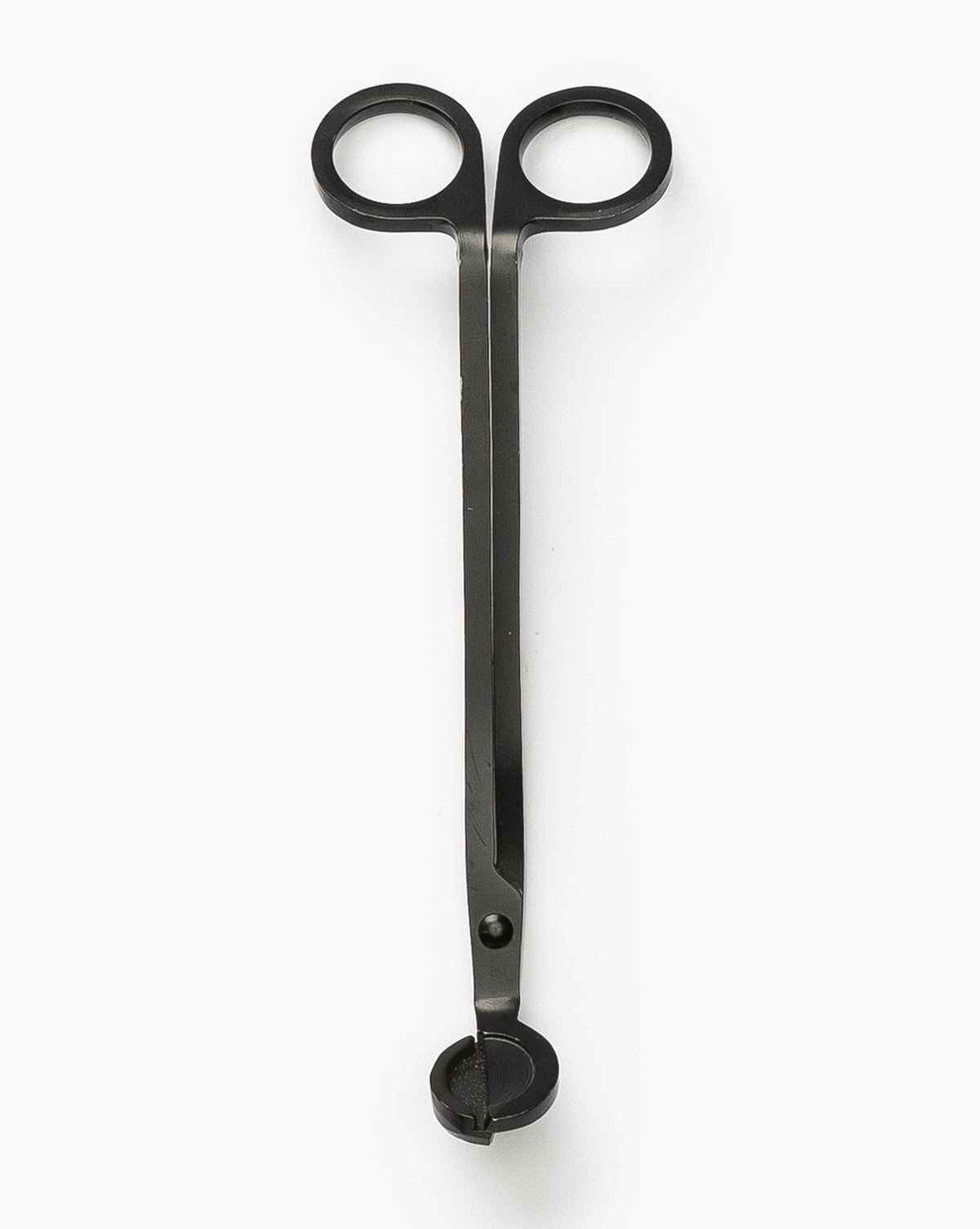 The Wick Trimmer features black metal, scissor-style handles, and a small circular tray by the blades—ideal for maintaining candle wicks and ensuring your candles last longer. Shown against a white background.