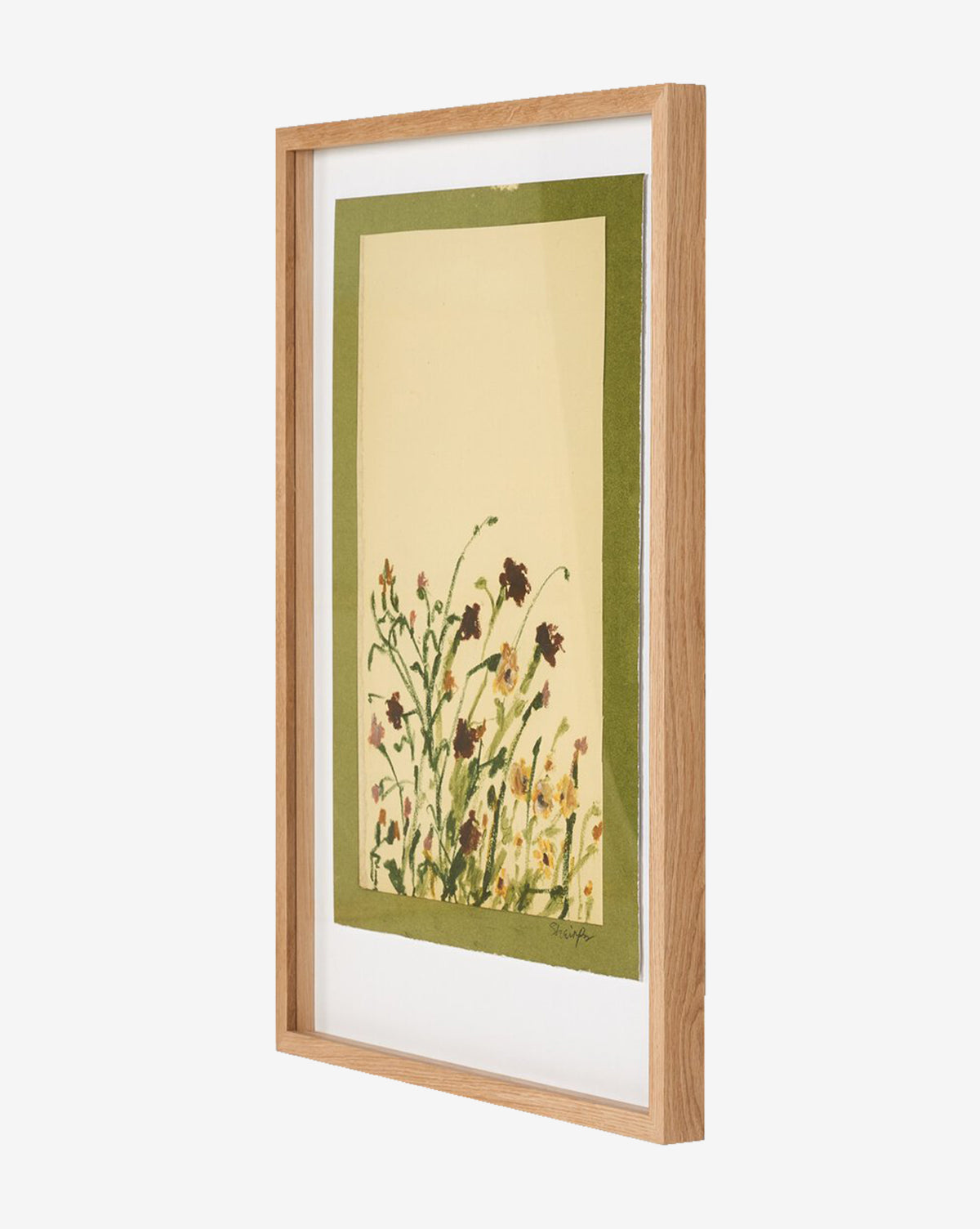 Wildflower Medley by Shaina Page features a botanical illustration of wildflowers on fine art paper, set on a cream background with a green border and displayed in a light oak frame shown from an angled side view, by McGee & Co.