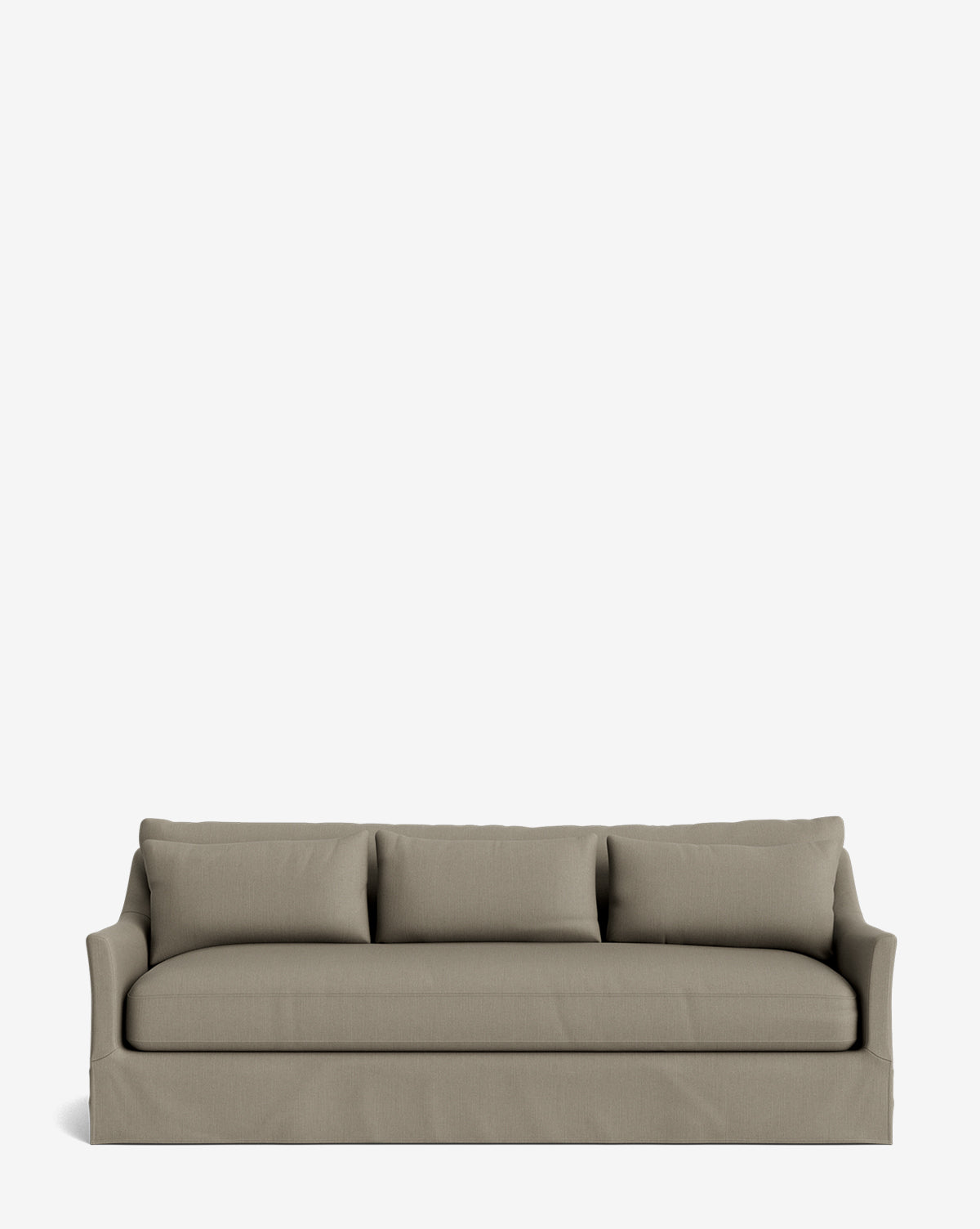 The Wilhelmina Deep Slipcover Sofa (85-110) is a beige, three-seat sofa with three back cushions and a tailored skirt, providing luxurious comfort against a plain white background by McGee & Co.