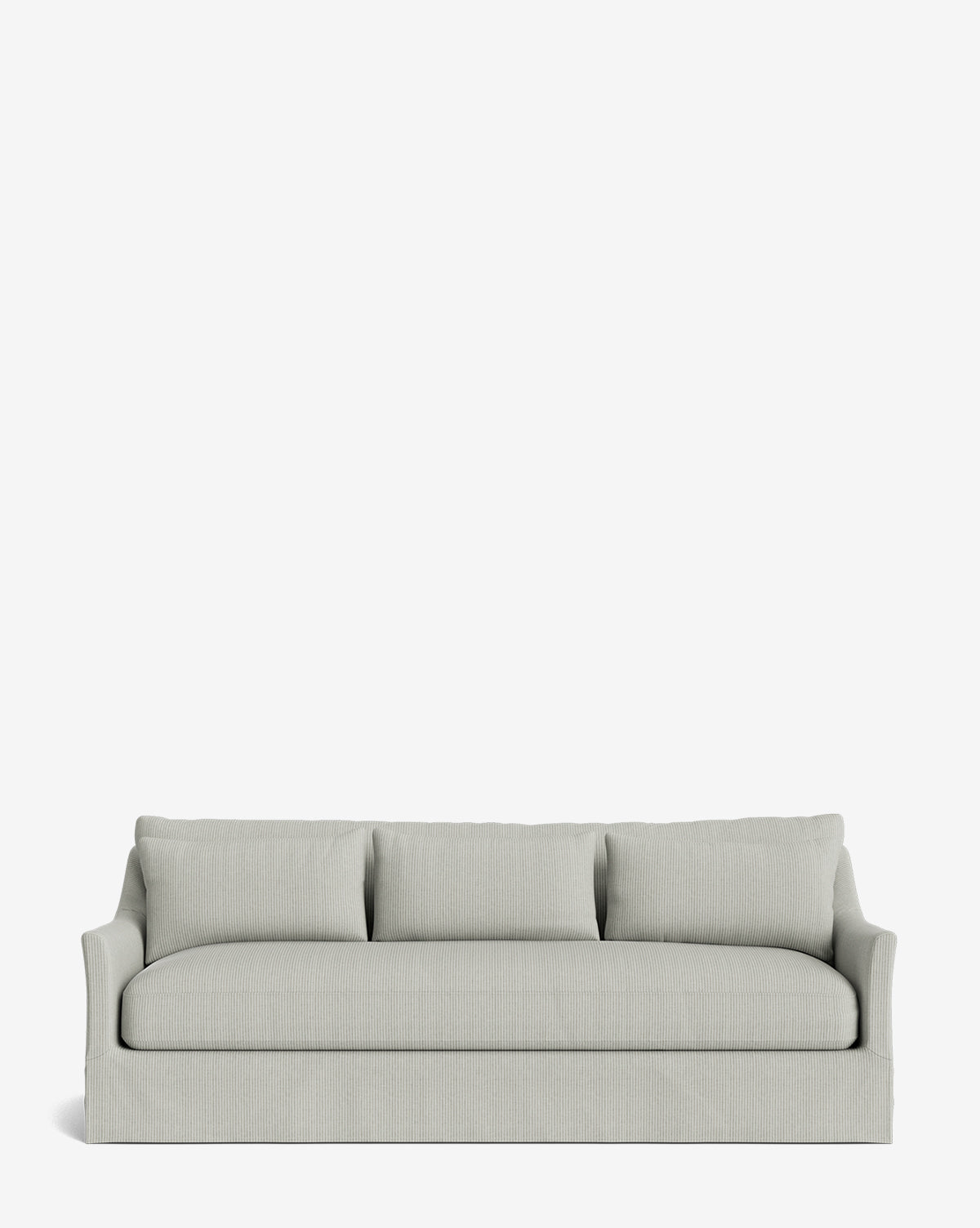 The Wilhelmina Classic Slipcover Sofa (85-110) in modern light gray, with three seat cushions, three back pillows, flared arms, and a skirted base, offers luxurious seating against a plain white background by McGee & Co.