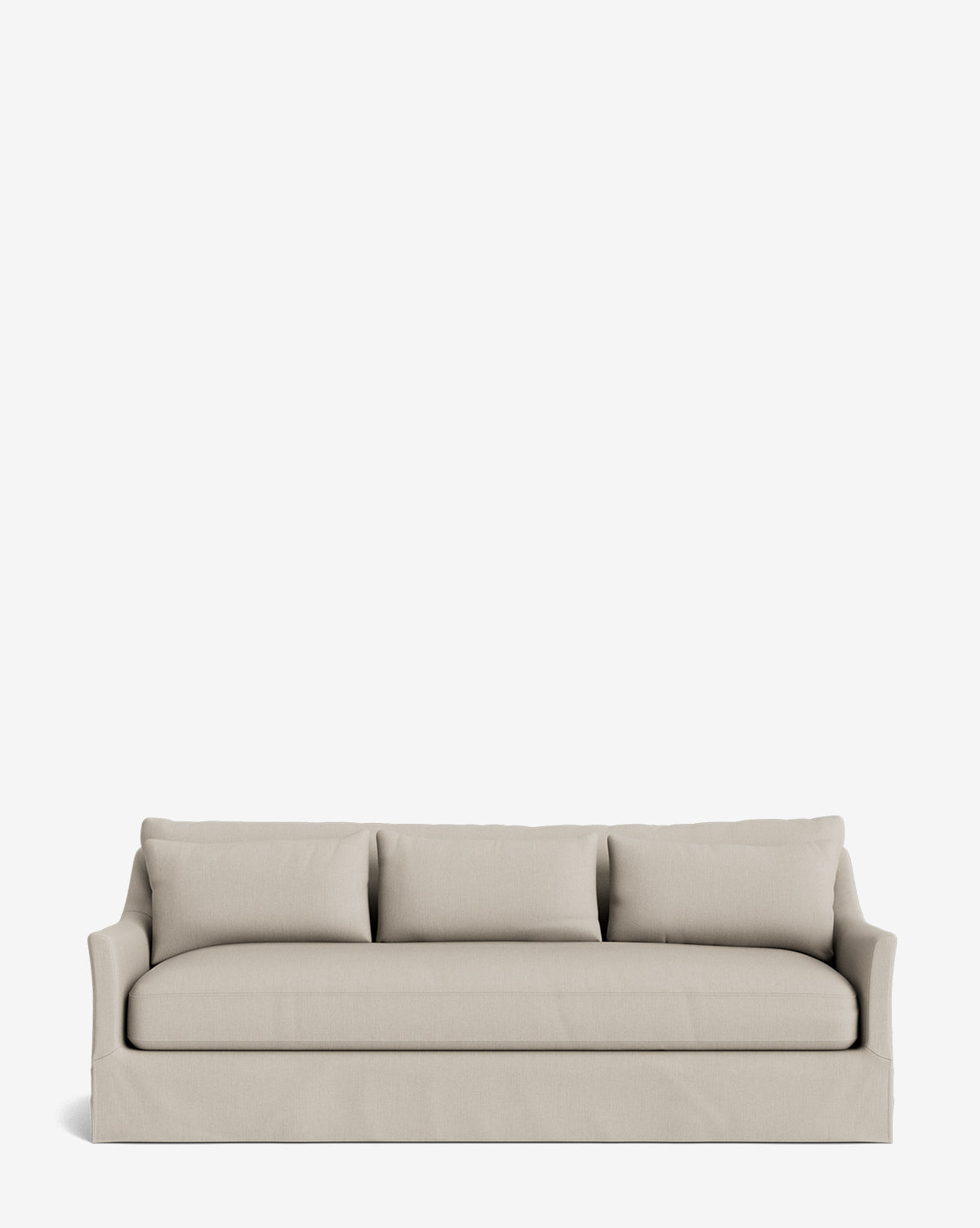 The Wilhelmina Deep Slipcover Sofa (85-110), featuring a beige three-cushion design with a skirted base and curved armrests, sits centered on a white background, showcasing its clean, modern style and luxurious comfort for contemporary spaces, by McGee & Co.