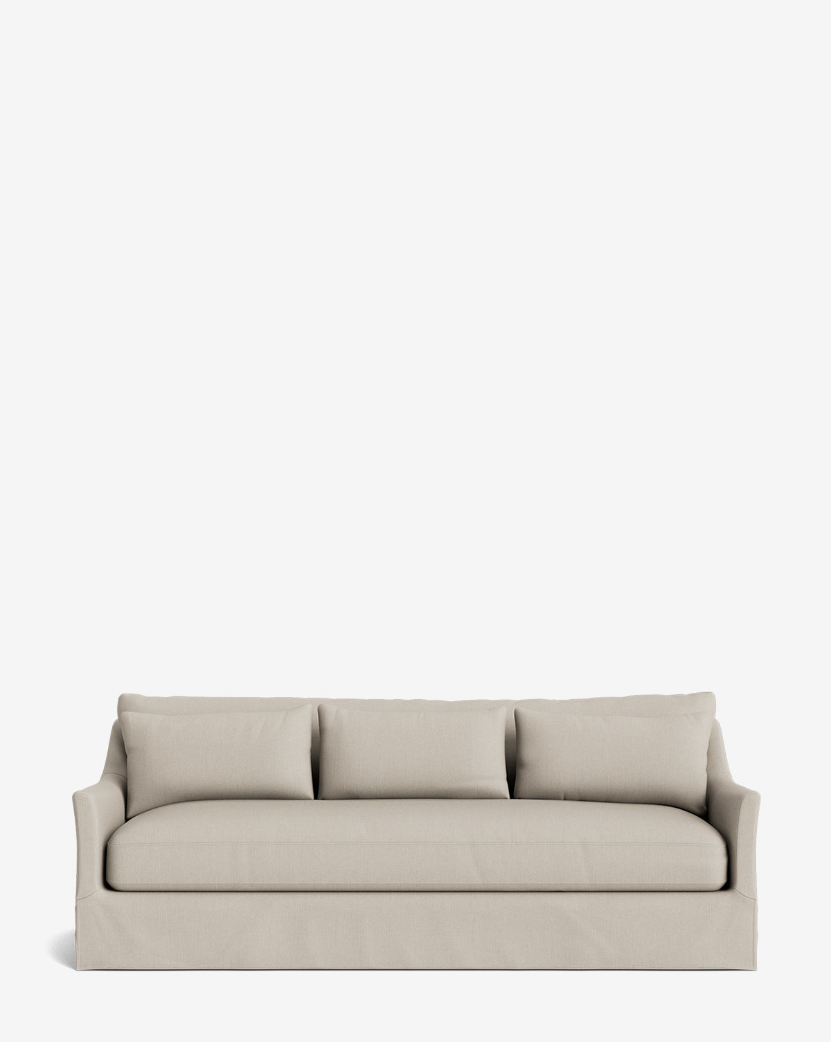 The Wilhelmina Classic Slipcover Sofa (85-110) in light beige, with three back cushions and low, slightly flared arms, offers luxurious seating for three against a plain white background, by McGee & Co.