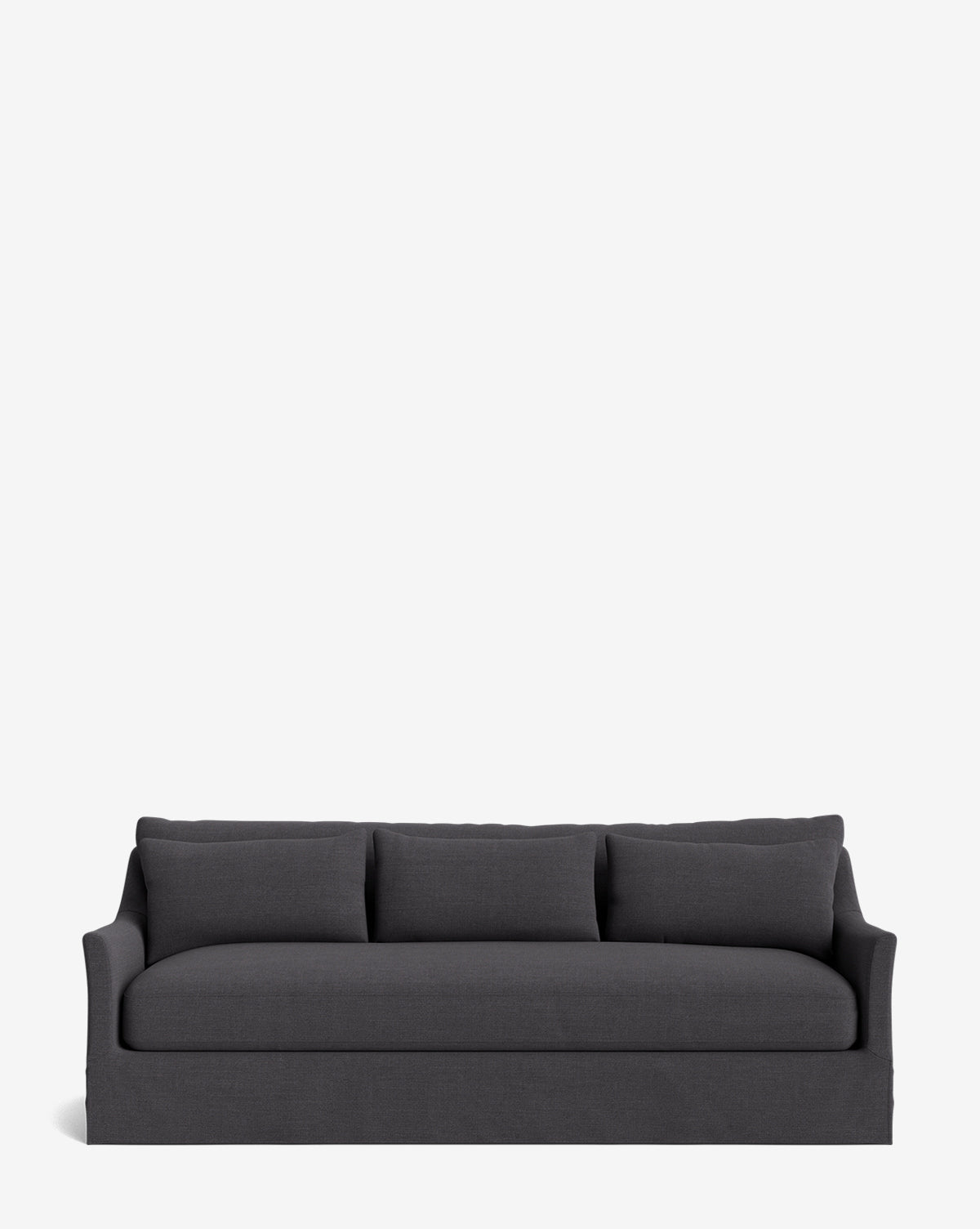 The Wilhelmina Classic Slipcover Sofa (85-110) features a dark gray cover, three back cushions, and gently curved armrests, providing a luxurious seat against a plain white background, by McGee & Co.