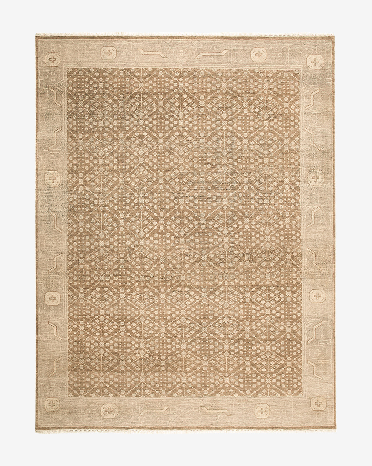 The Windsor Hand-Knotted Wool Rug is a rectangular tan and beige wool rug featuring an intricate geometric center pattern and a wide border with subtle floral and linear details, by McGee & Co.