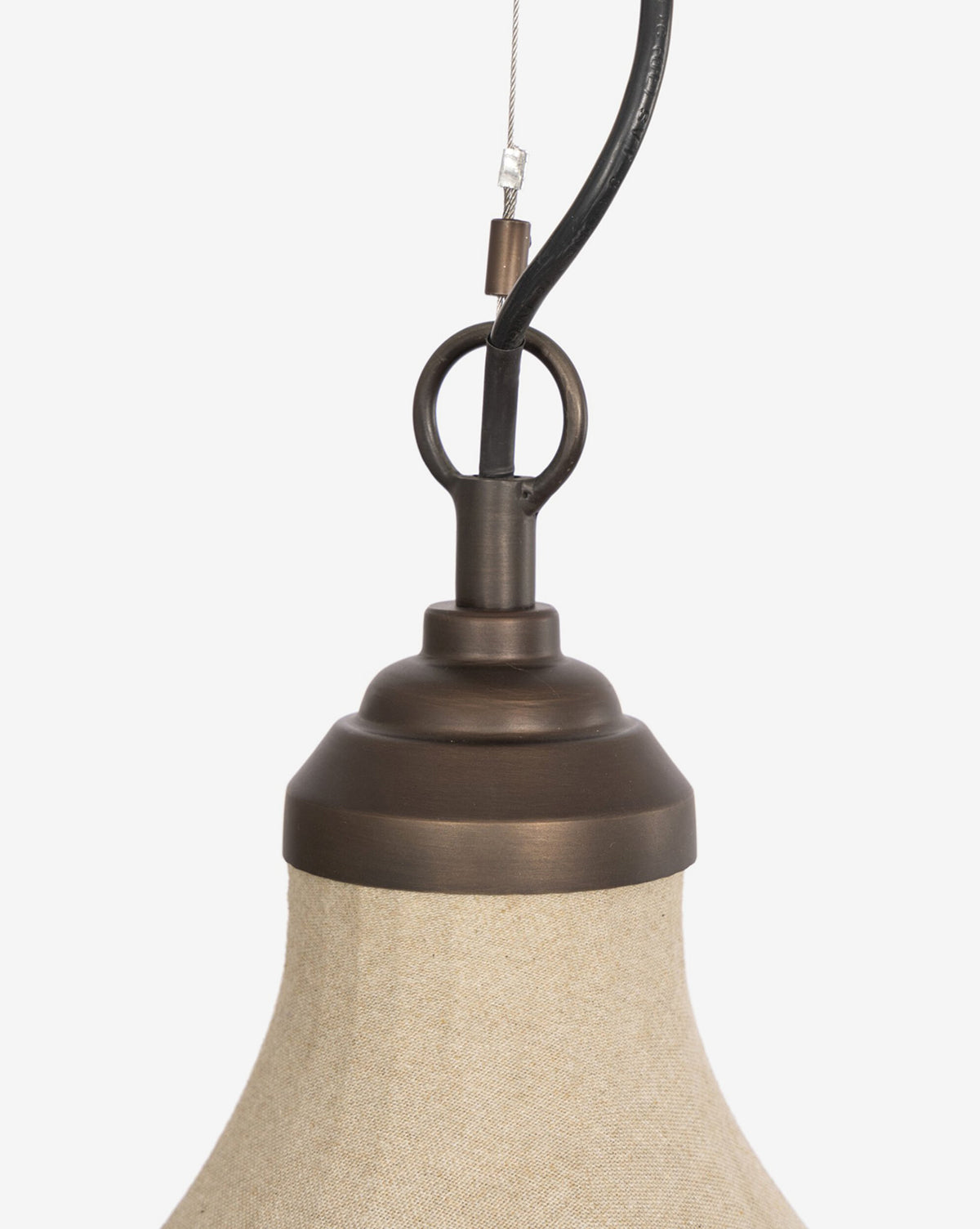 Close-up of the Winslet Pendant’s top, featuring a brass circular loop and beige linen shade, set against a plain white background—a perfect modern lighting piece, by McGee & Co.