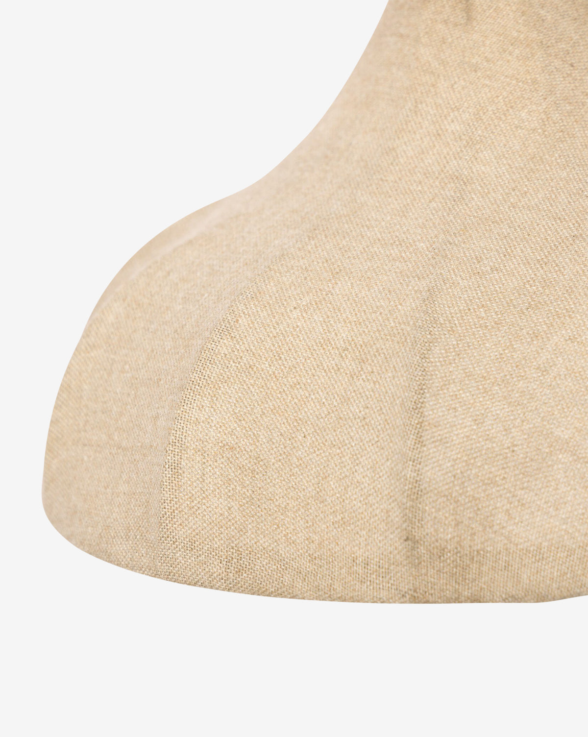 Close-up of a beige fabric mannequin neck and upper chest, highlighting textured cloth and fine stitching, echoing the refined look of the Winslet Sconce's linen shade, by McGee & Co.