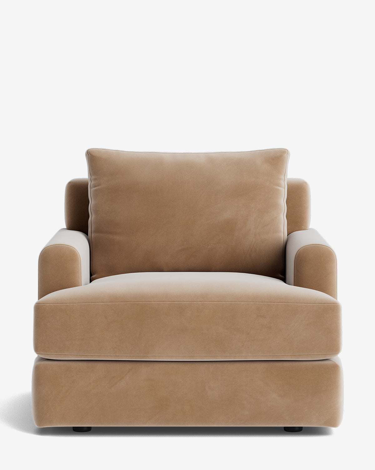 The Winthrop Lounge Chair is a modern piece in tan velvet, featuring plush cushions, wide armrests, and a boxy design, shown from the front against a white background by McGee & Co.