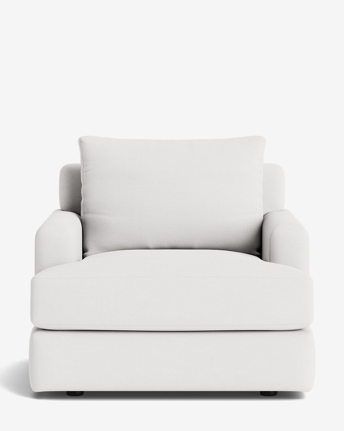 The Winthrop Lounge Chair is a modern, oversized lounge chair upholstered in white fabric with a plush back cushion and wide armrests, shown on a plain white background by McGee & Co.