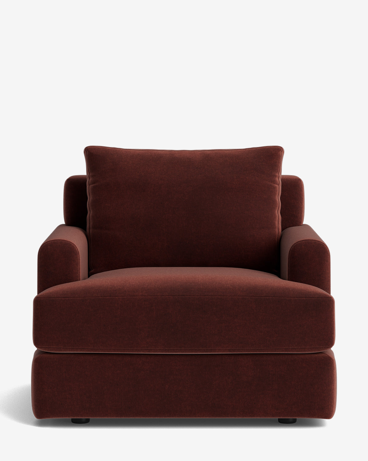 The Winthrop Lounge Chair is a wide, deep-seated armchair with plush cushions, rounded armrests, and dark brown velvet upholstery. Shown against a plain white background, it offers modern comfort and style by McGee & Co.