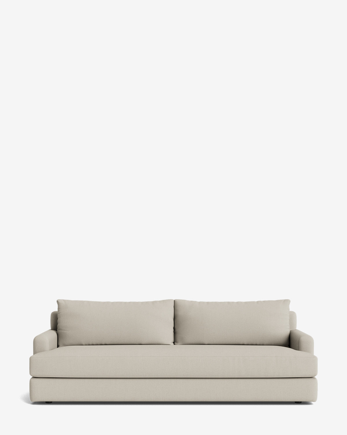 The Winthrop Sofa 90 is a modern, light beige, made-to-order sofa with two large back cushions and straight, low armrests, shown against a plain white background by McGee & Co.