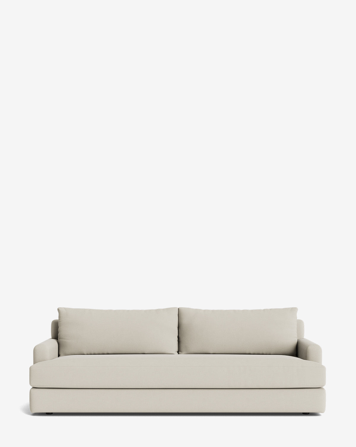 The Winthrop Sofa 90 is a modern, made-to-order beige sofa with two large back cushions and low armrests, shown against a plain white background, by McGee & Co.
