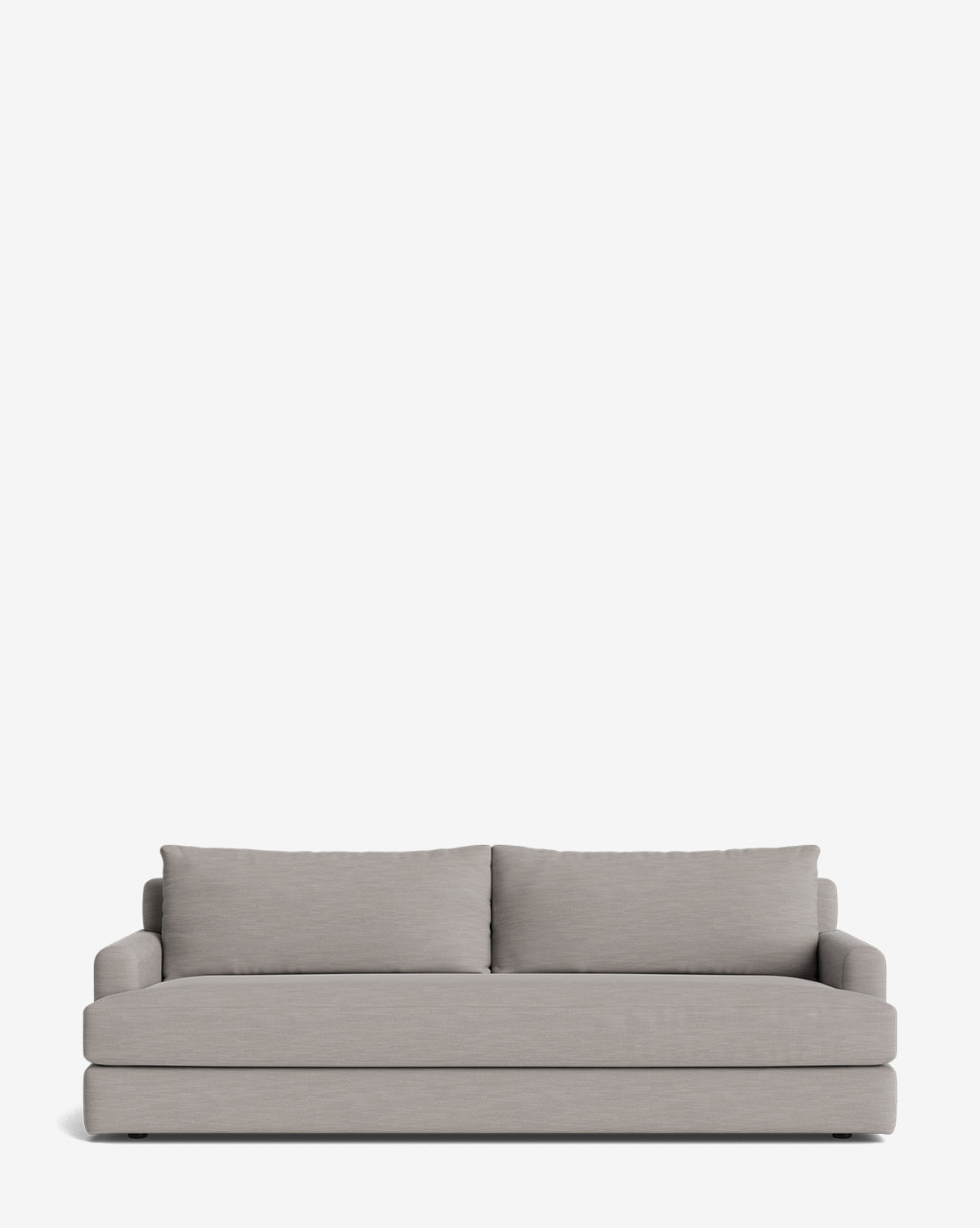 The Winthrop Sofa 90 is a modern, light grey upholstered piece with two large back cushions and low padded arms. Its minimalist, rectangular design is made-to-order and shown against a plain white background, by McGee & Co.