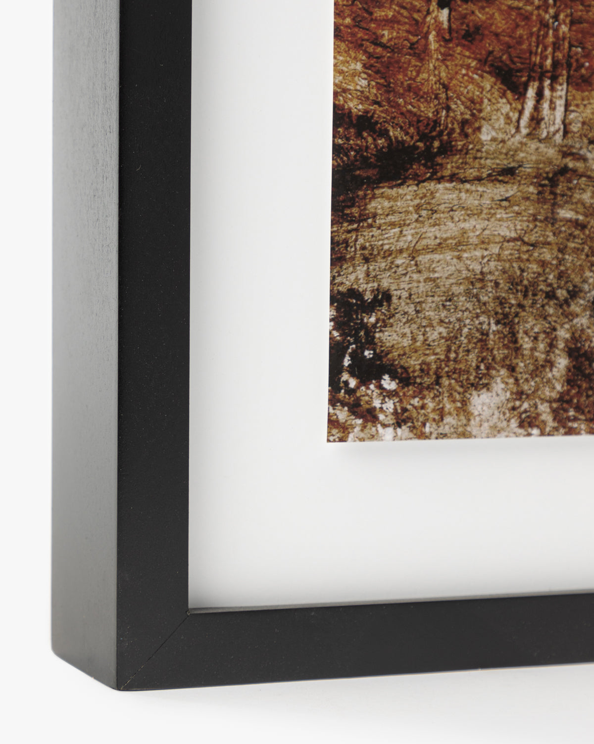 Close-up of the corner of a black, gallery-quality picture frame with a white mat displaying Woodbury by Dan Hobday, featuring an expressive landscape with textured, earthy details.